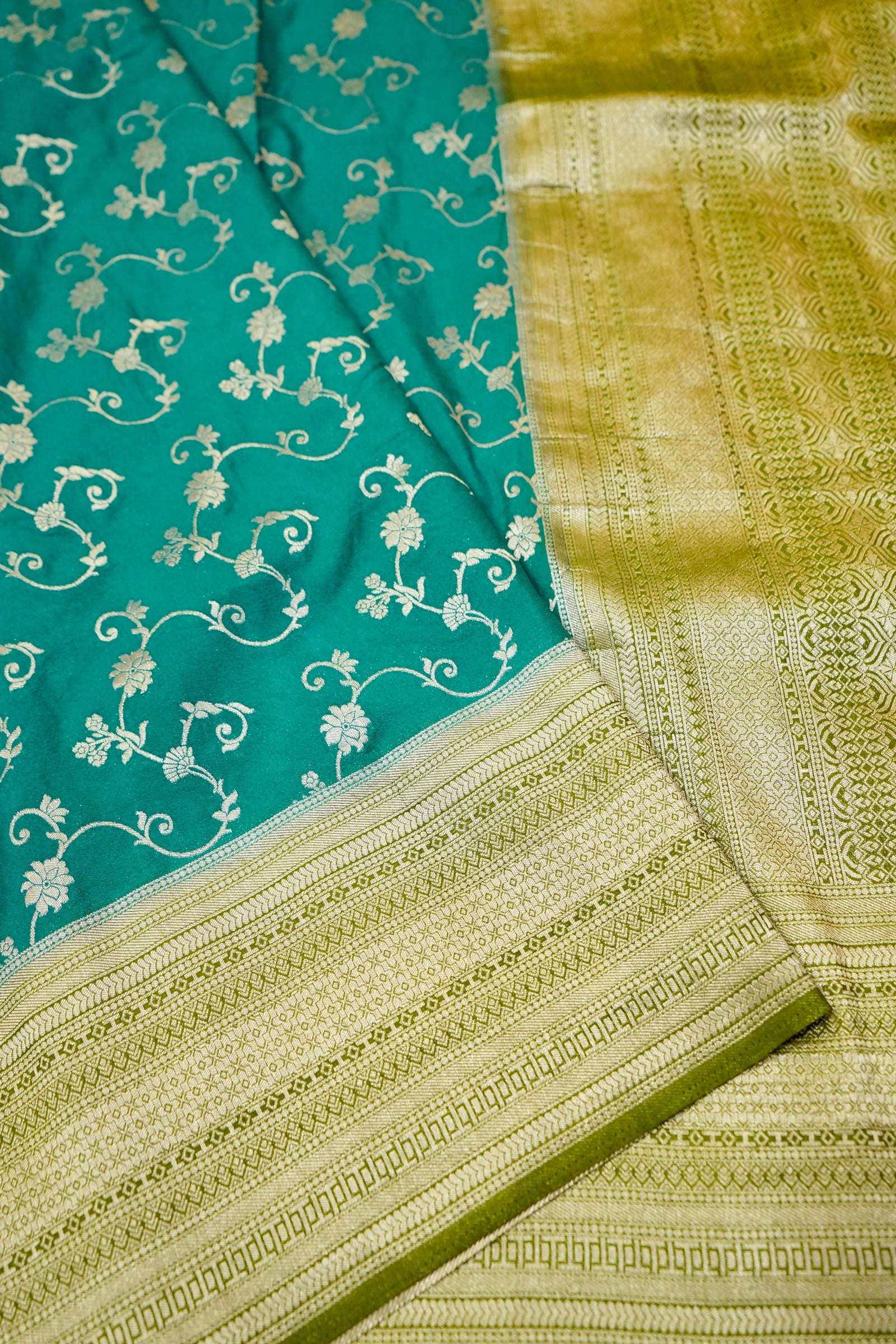 Teal Green Crepe Georgette Silk Saree with Gold Zari Border