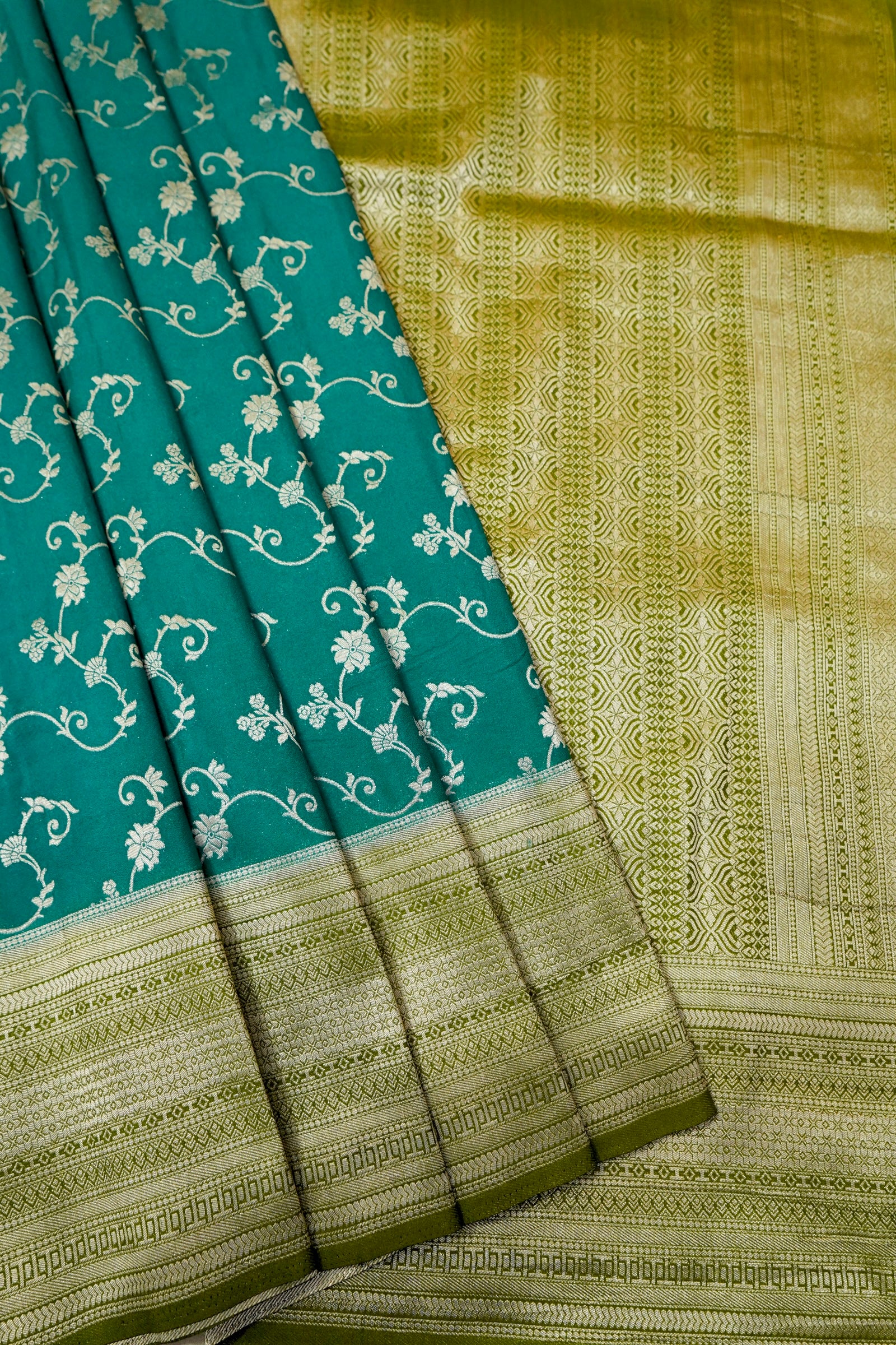 Teal Green Crepe Georgette Silk Saree with Gold Zari Border