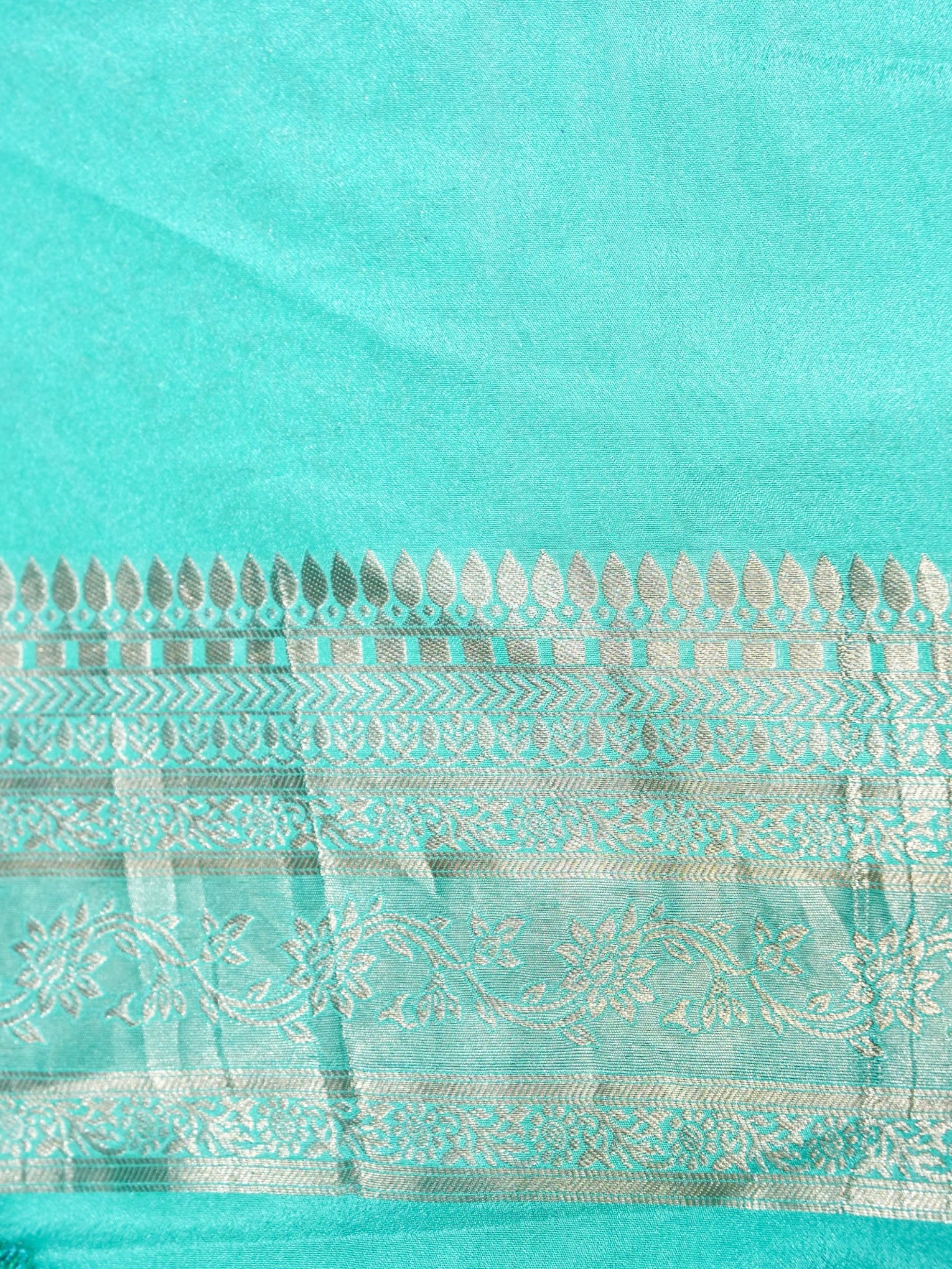 Teal Green Crepe Georgette Silk Saree with Champagne Gold Border