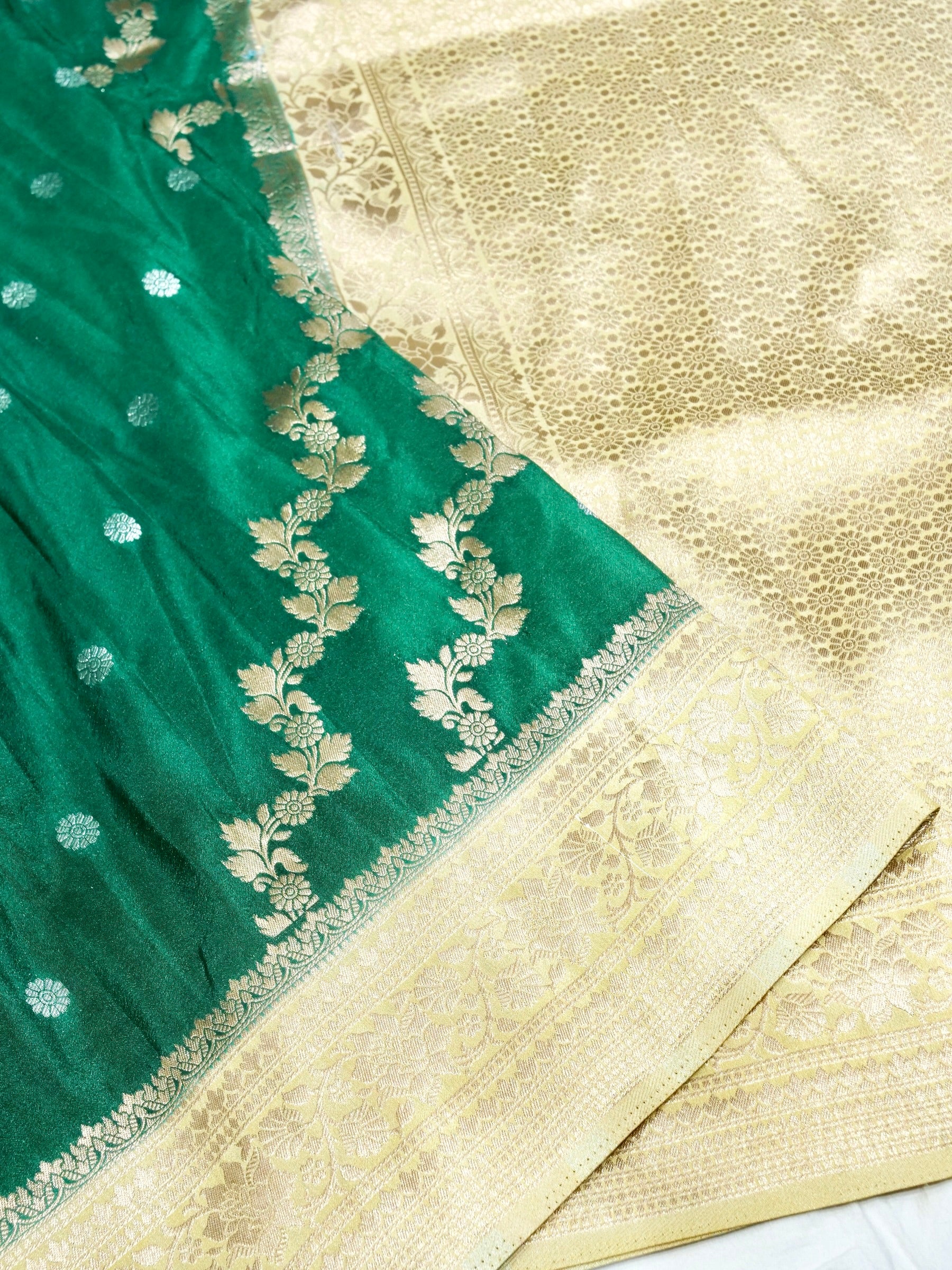 Emerald Green Crepe Georgette Silk Saree with Champagne Gold Border
