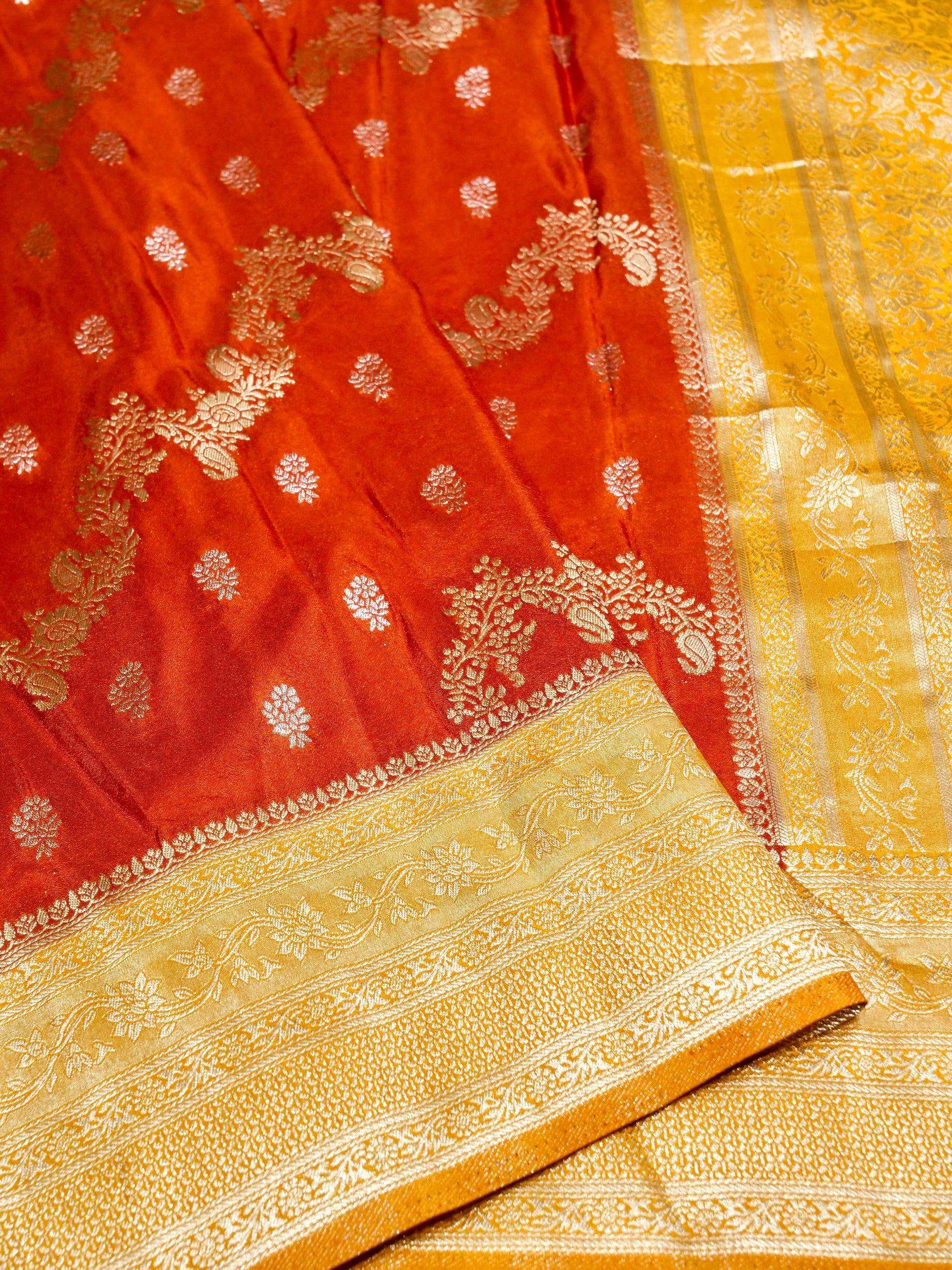 Burnt Orange Crepe Georgette Silk Saree with Yellow and Champagne Gold Border