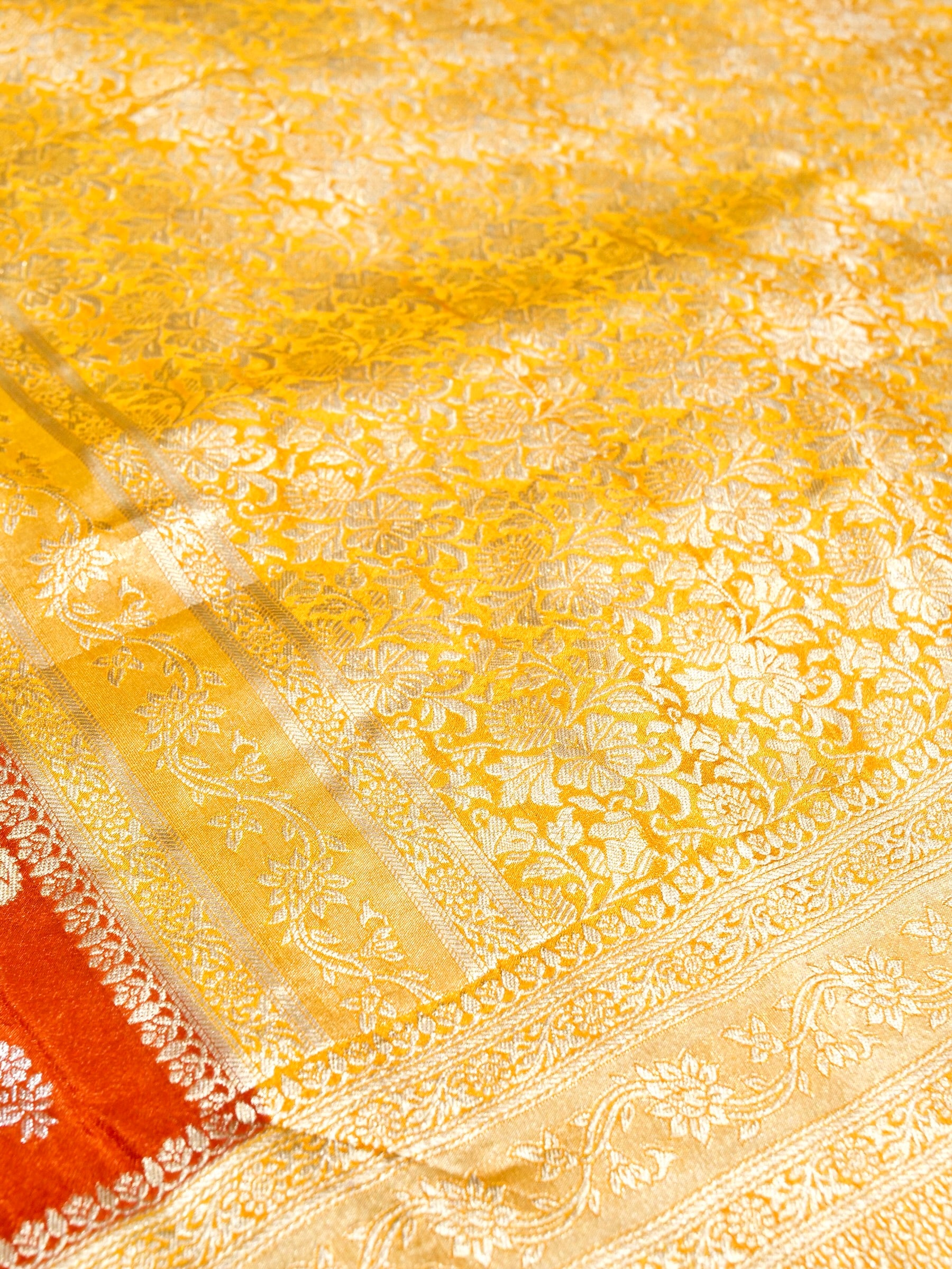Burnt Orange Crepe Georgette Silk Saree with Yellow and Champagne Gold Border