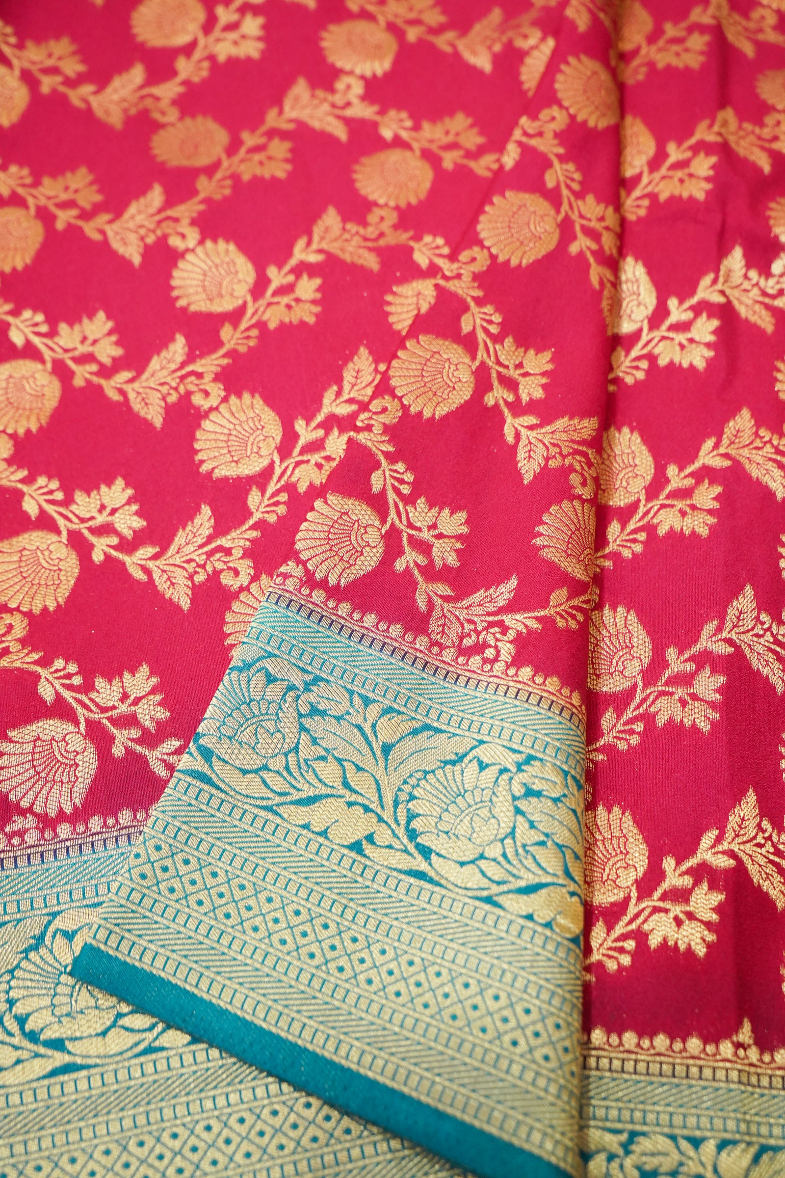 Deep Pink Crepe Georgette Silk Saree with Teal and Gold Zari Border