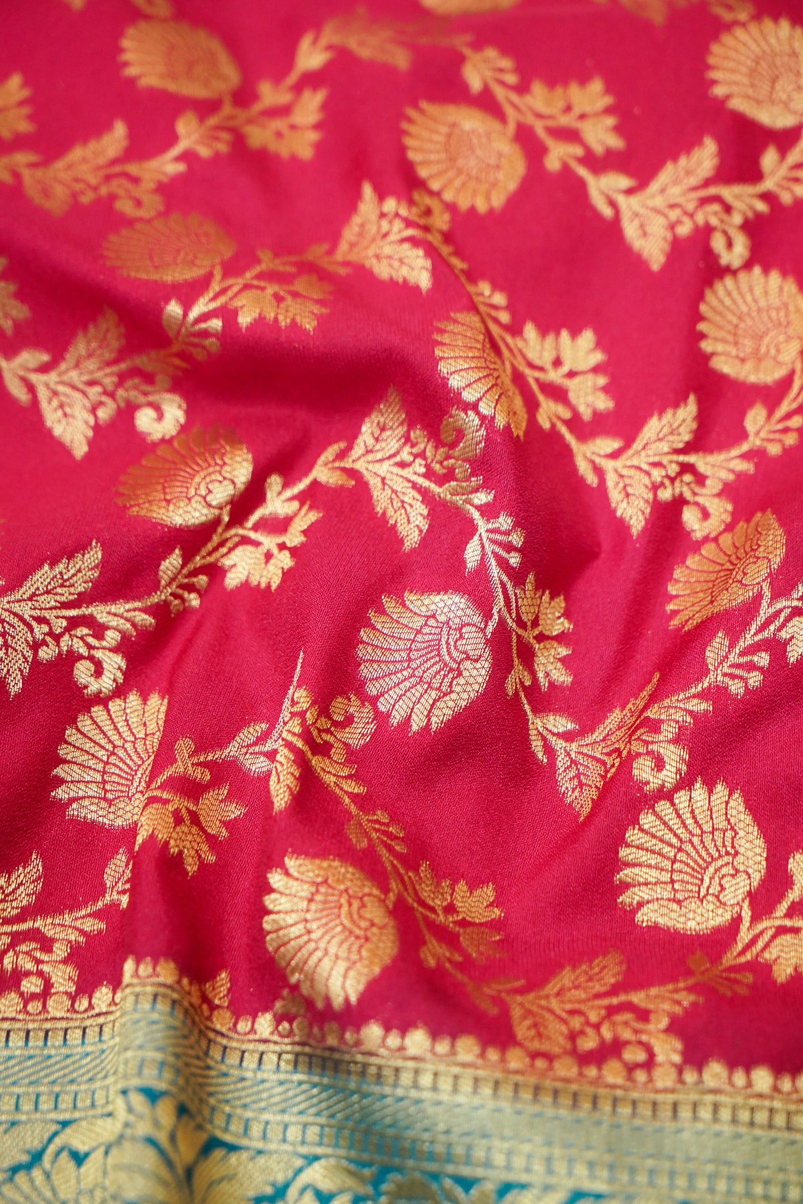 Deep Pink Crepe Georgette Silk Saree with Teal and Gold Zari Border