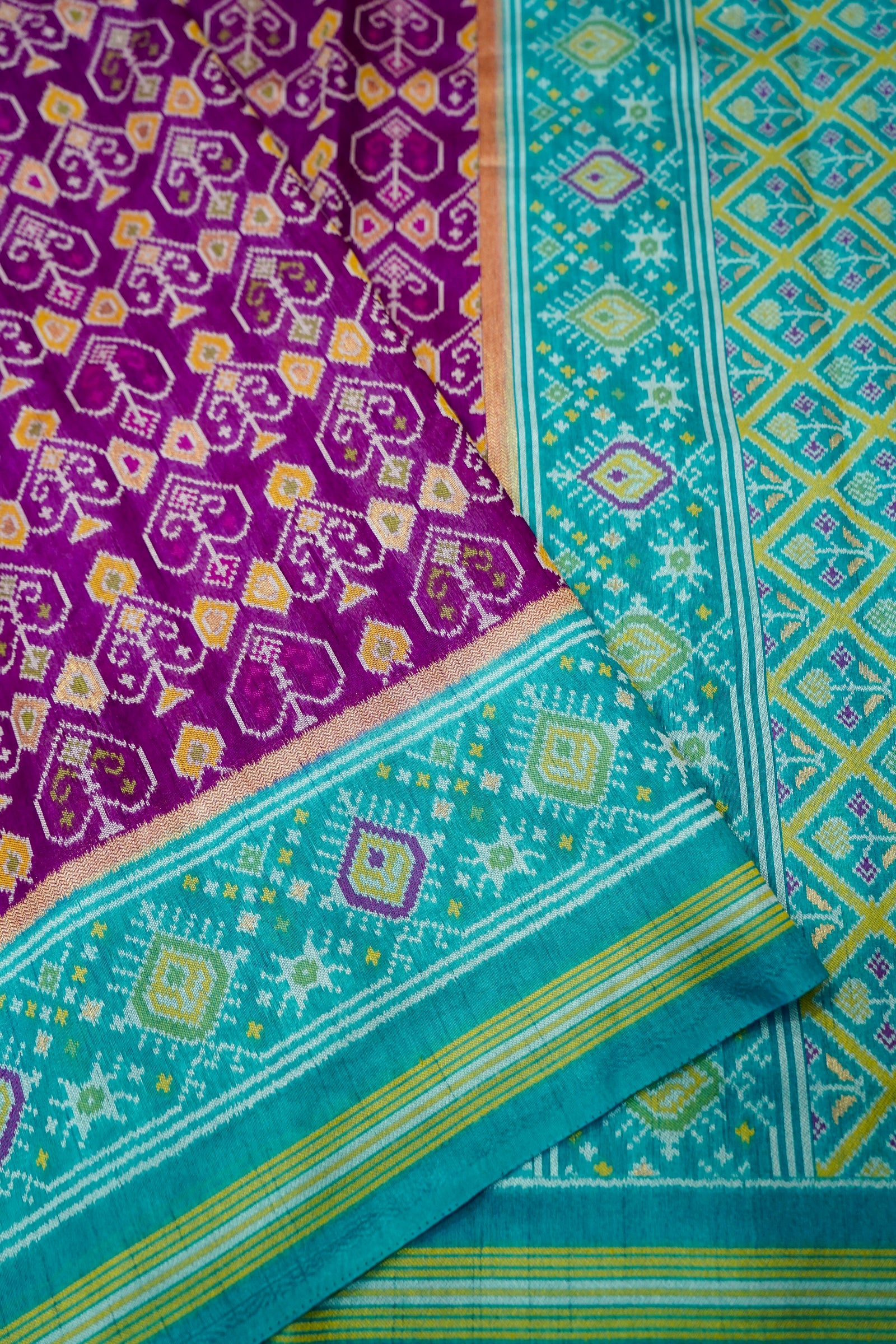 Purple Dupion Patola Saree with Teal Border & Traditional Motif Weave