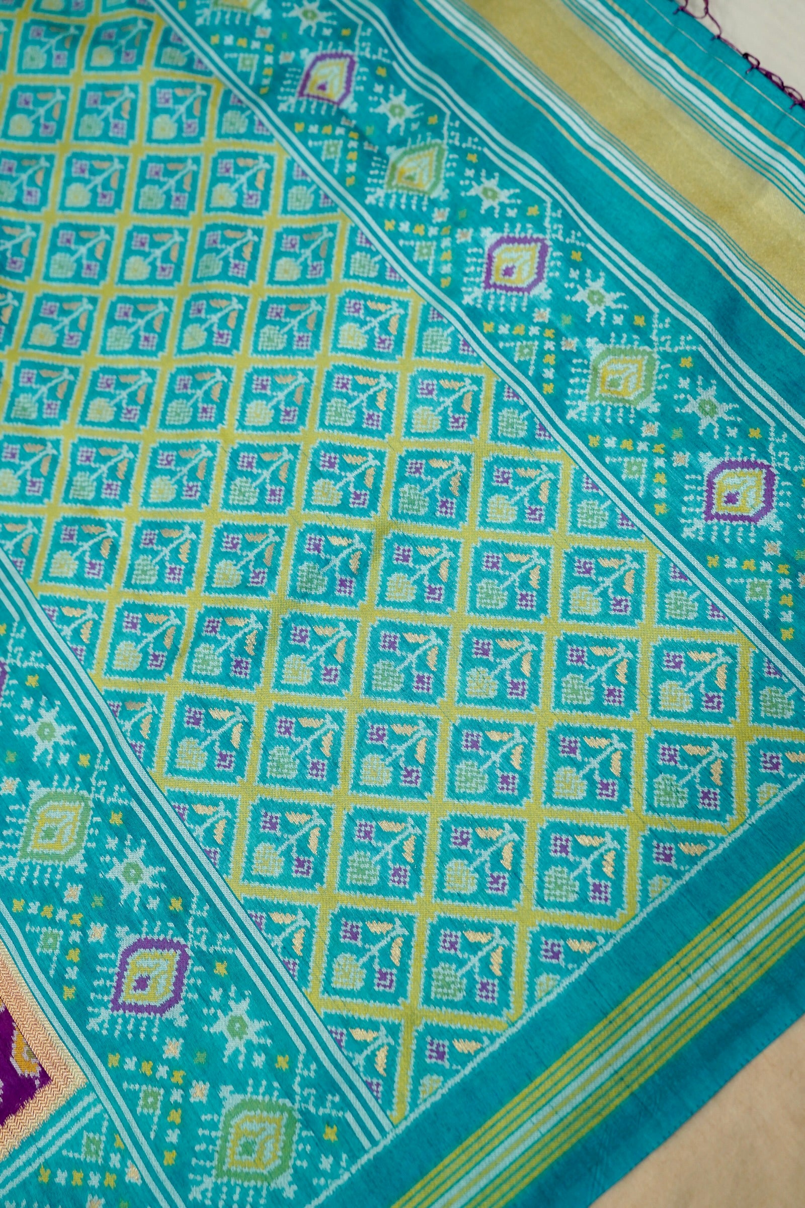 Purple Dupion Patola Saree with Teal Border & Traditional Motif Weave