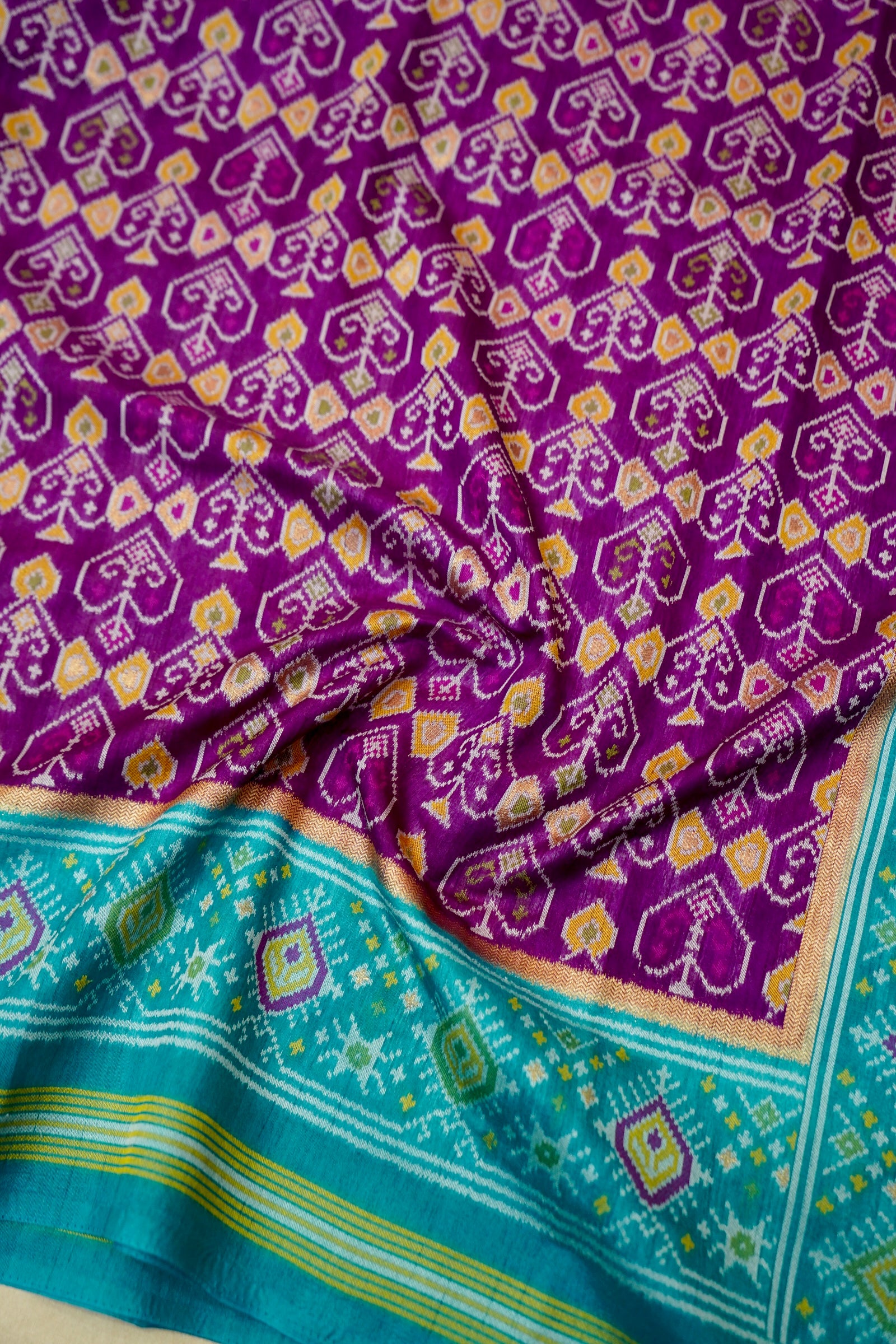Purple Dupion Patola Saree with Teal Border & Traditional Motif Weave