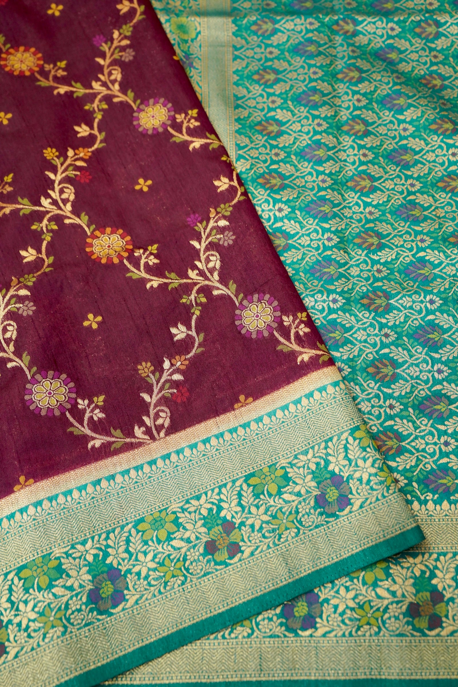 Wine Purple Dupion Patola Saree with Mint Green Border & Delicate Gold Zari Motifs