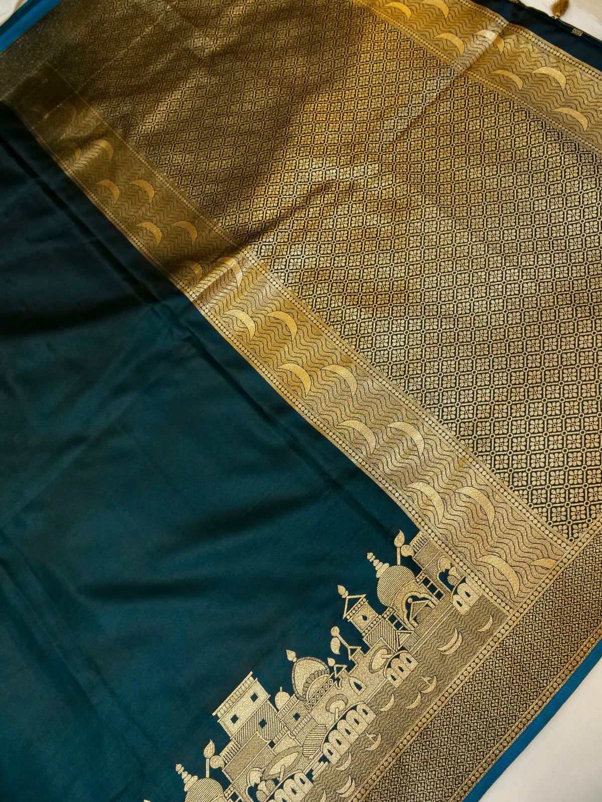 Nihar - Deep Teal Blue Ghat Border Banarasi Silk Saree with Stitched Blouse