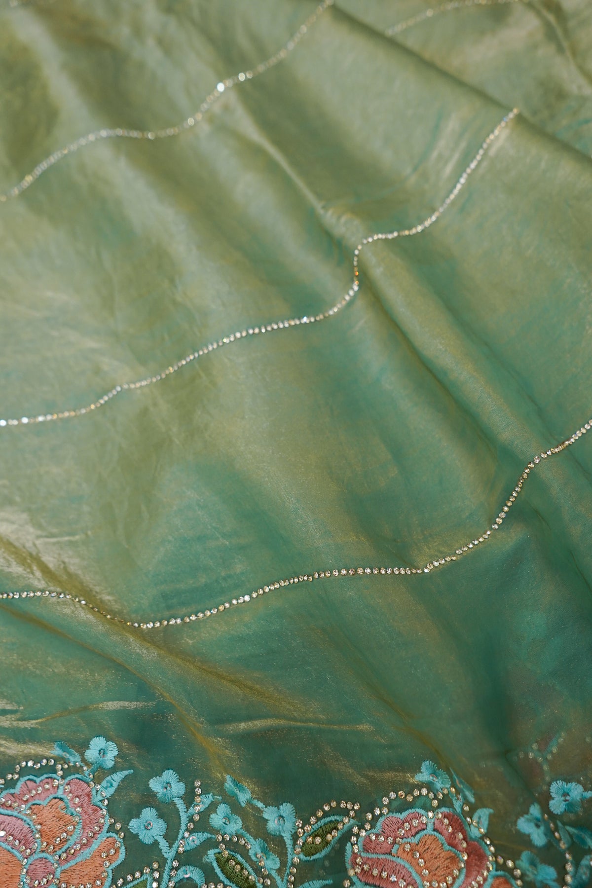 Aqua Blue Camellia Bloom Designer Tissue Saree with Rhinestone