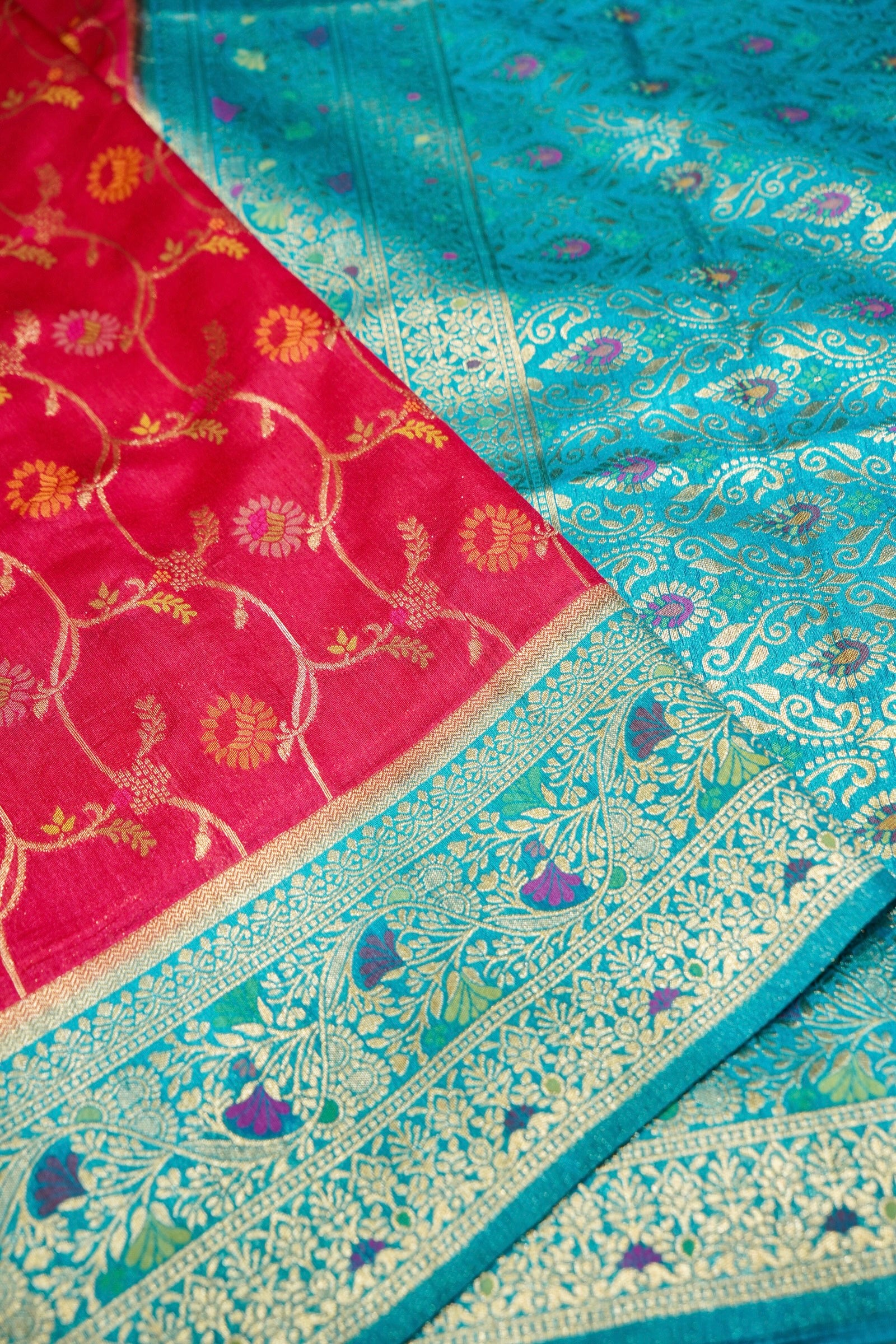 Ruby Pink Ikkat Patola Silk Saree with Turquoise Blue Border