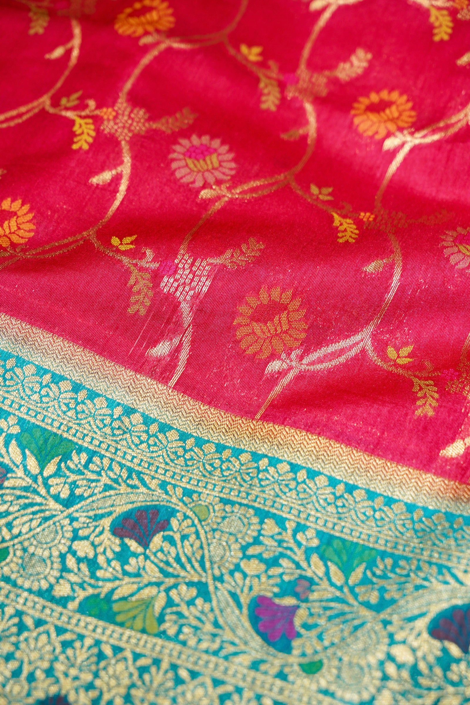 Ruby Pink Ikkat Patola Silk Saree with Turquoise Blue Border