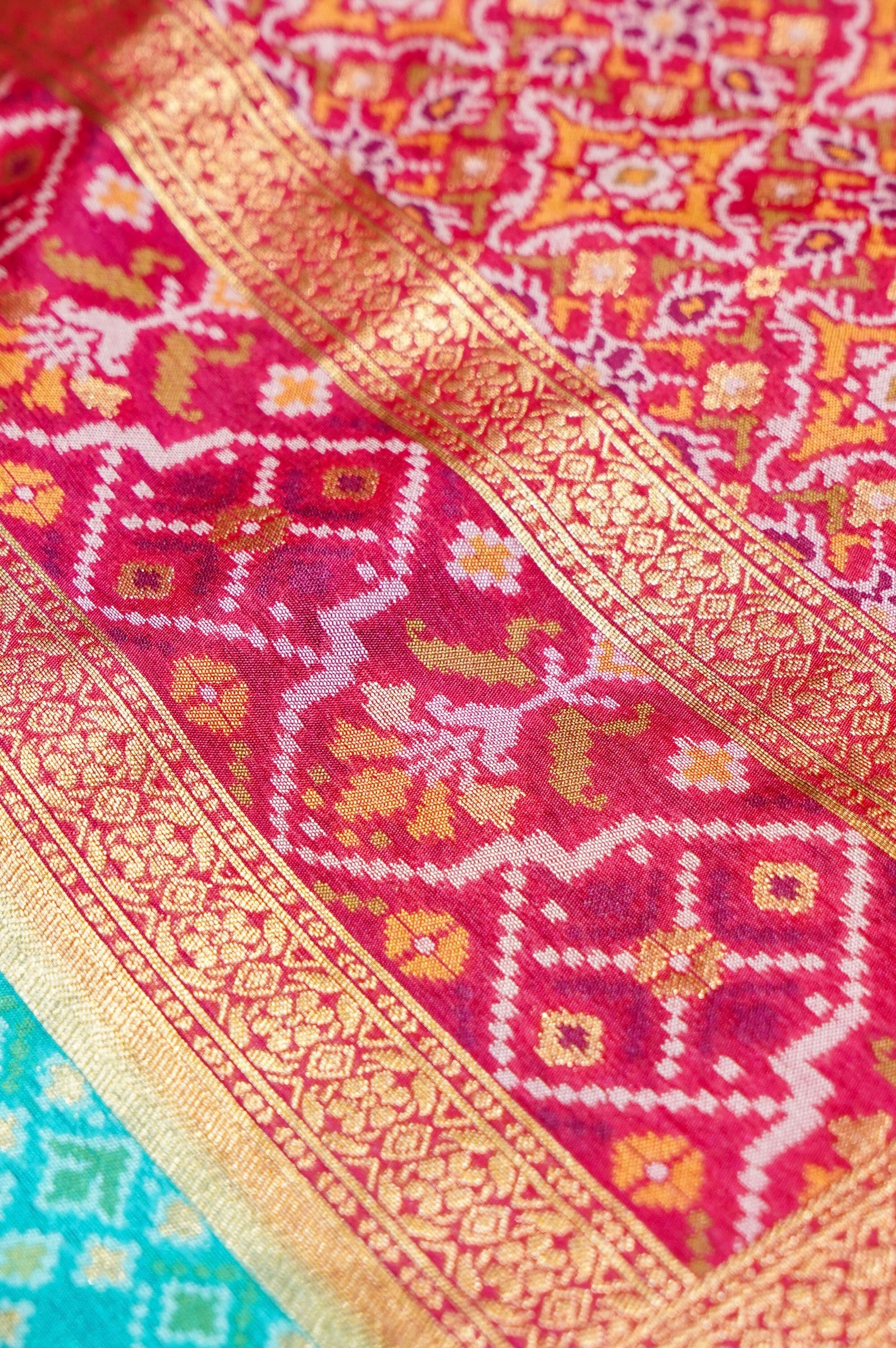 Aqua Blue Ikkat Patola Silk Saree with Rani Pink Border