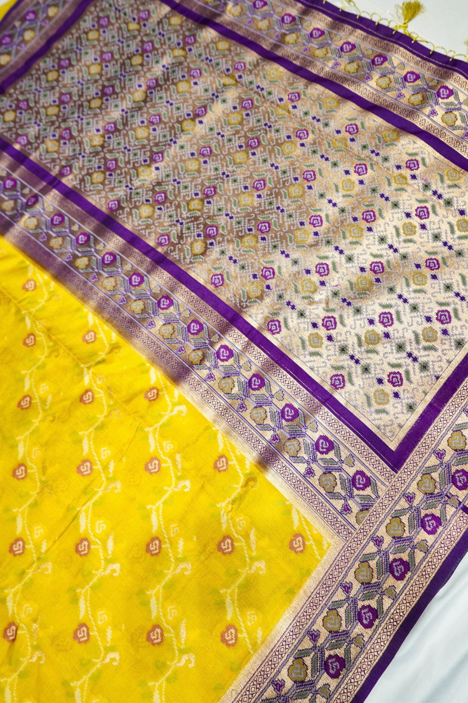Sunshine Yellow Ikkat Patola Silk Saree with Violet Border