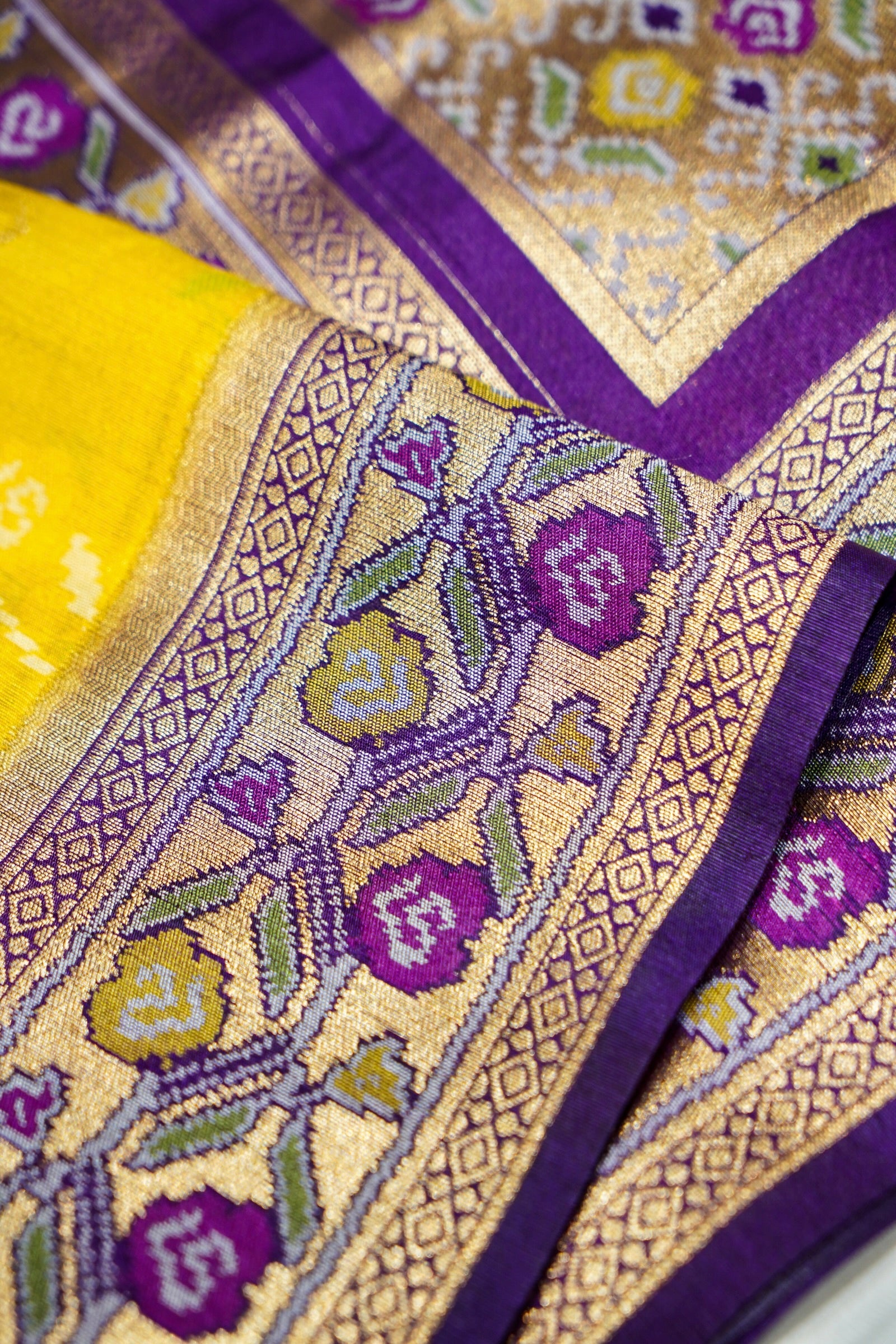 Sunshine Yellow Ikkat Patola Silk Saree with Violet Border