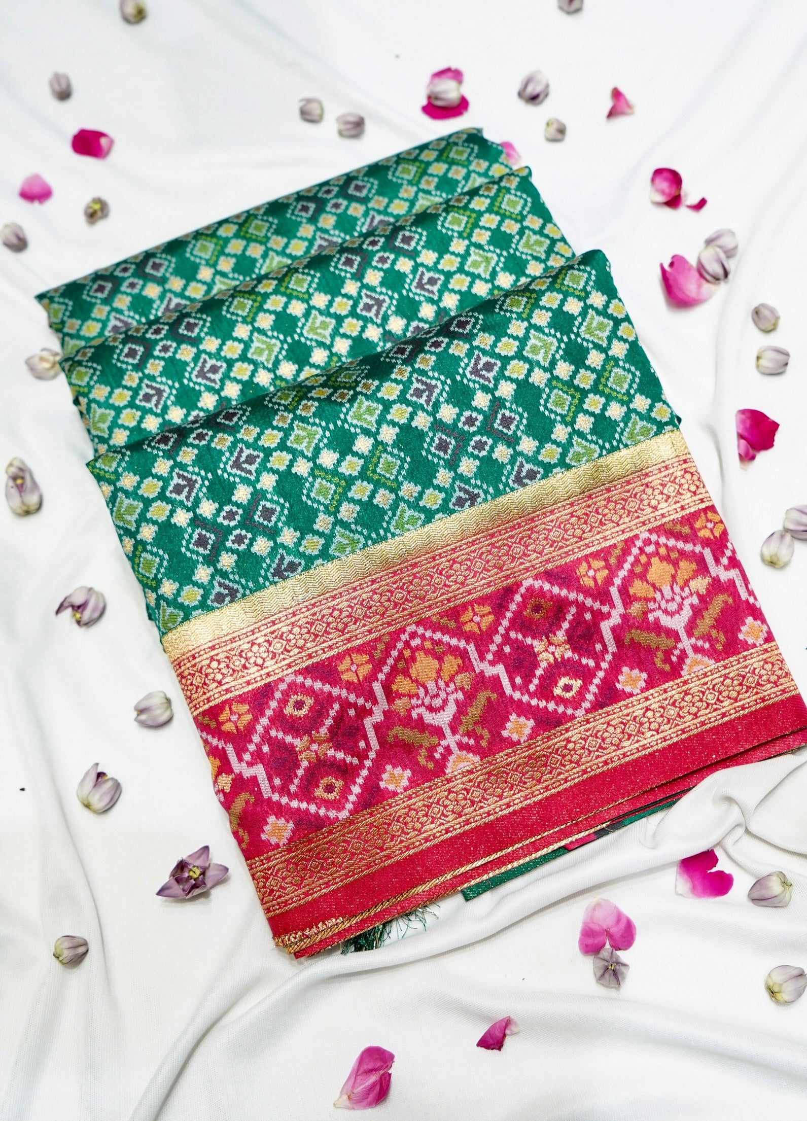 Emerald Green Ikkat Patola Silk Saree with Rani Pink Border