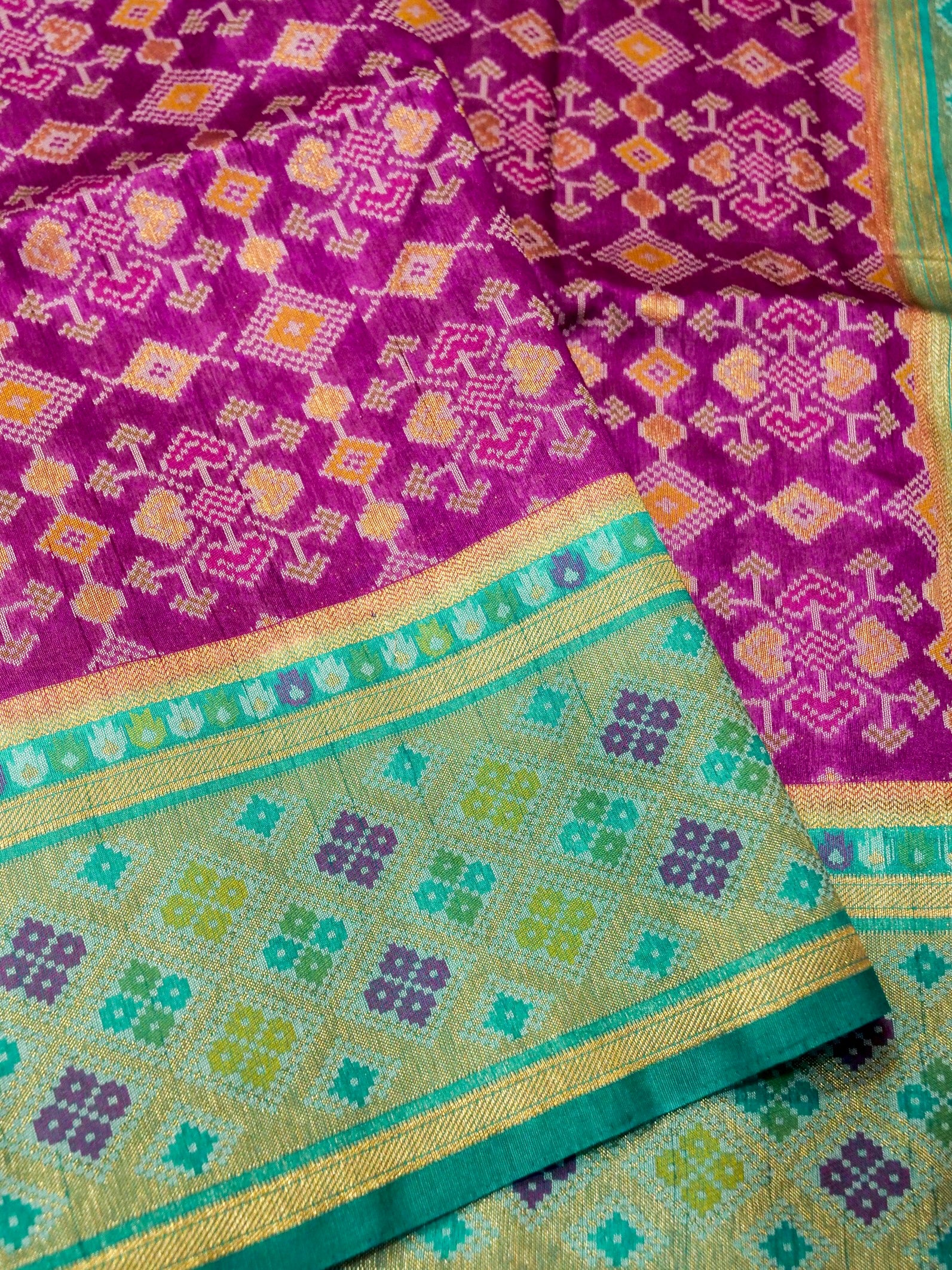 Orchid Purple Patola Silk Saree with Contrast Turquoise Blue Border