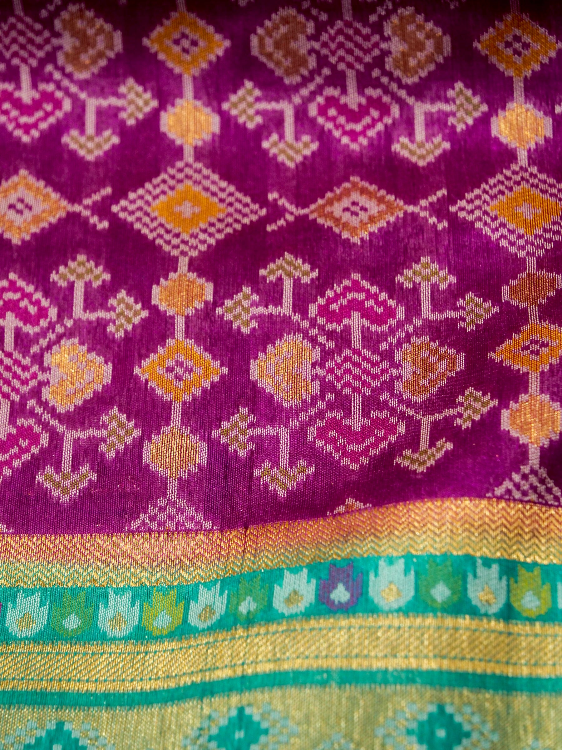 Orchid Purple Patola Silk Saree with Contrast Turquoise Blue Border