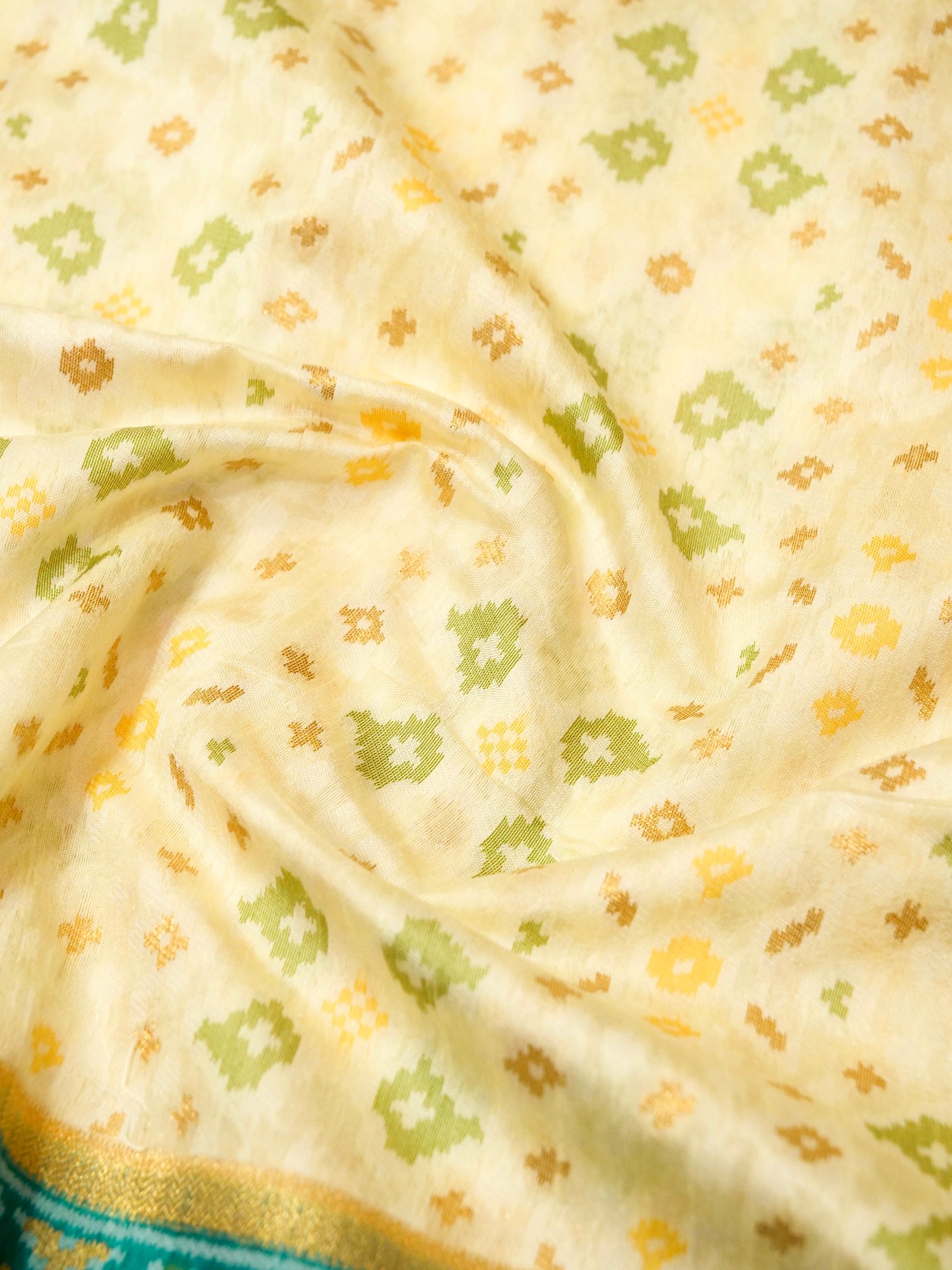 Soft Ivory Patola Silk Saree with Turquoise Green Border