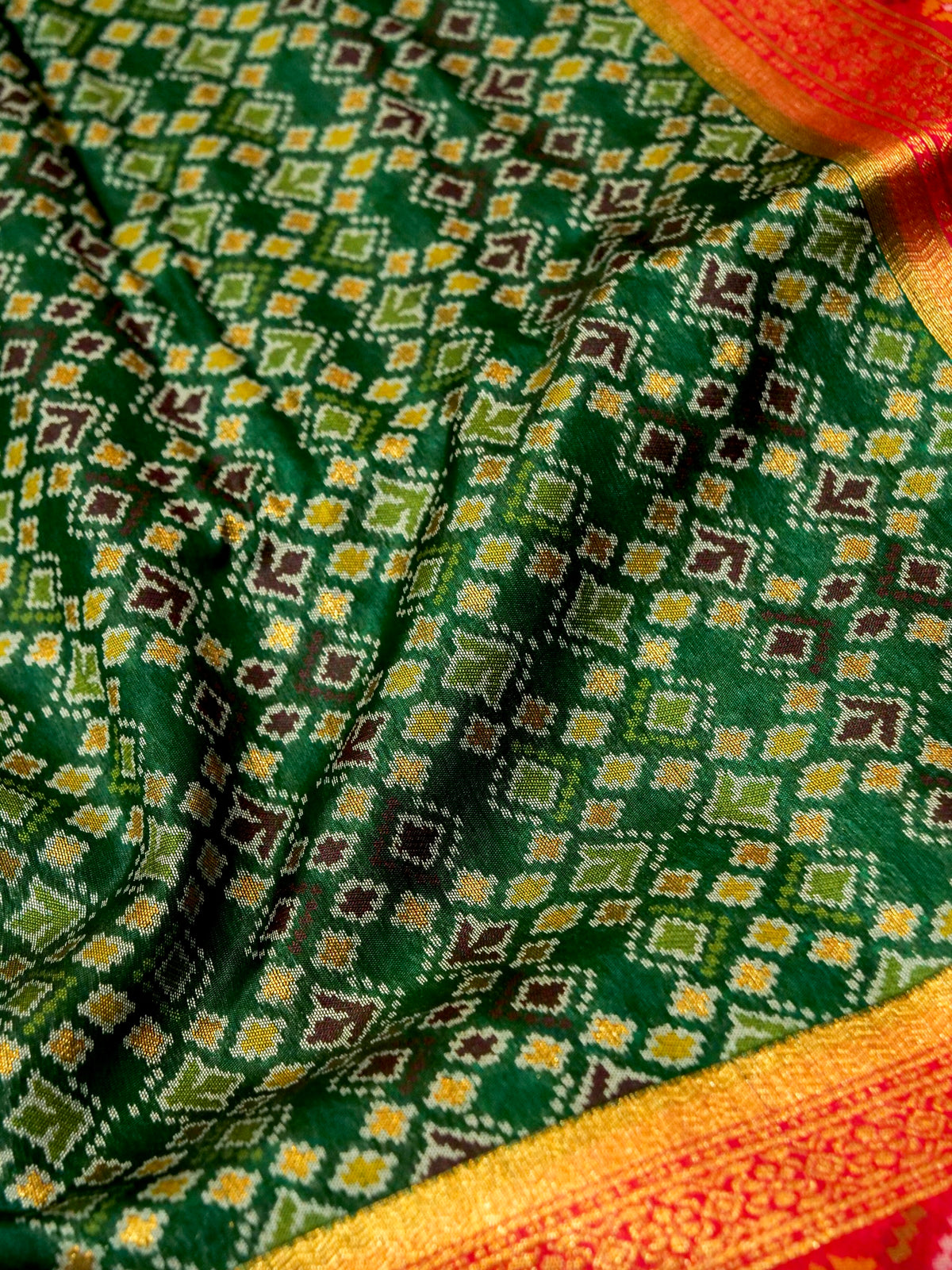 Emerald Green Patola Silk Saree with Contrast Rani Pink Border