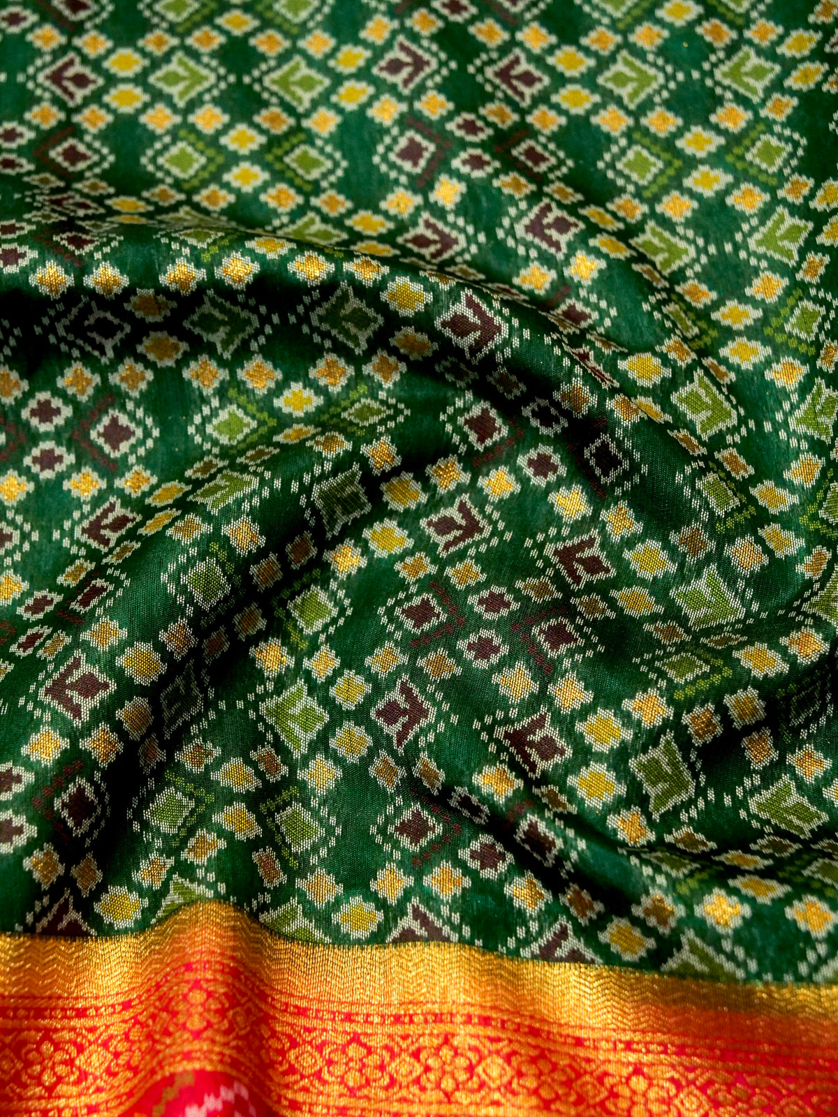 Emerald Green Patola Silk Saree with Contrast Rani Pink Border