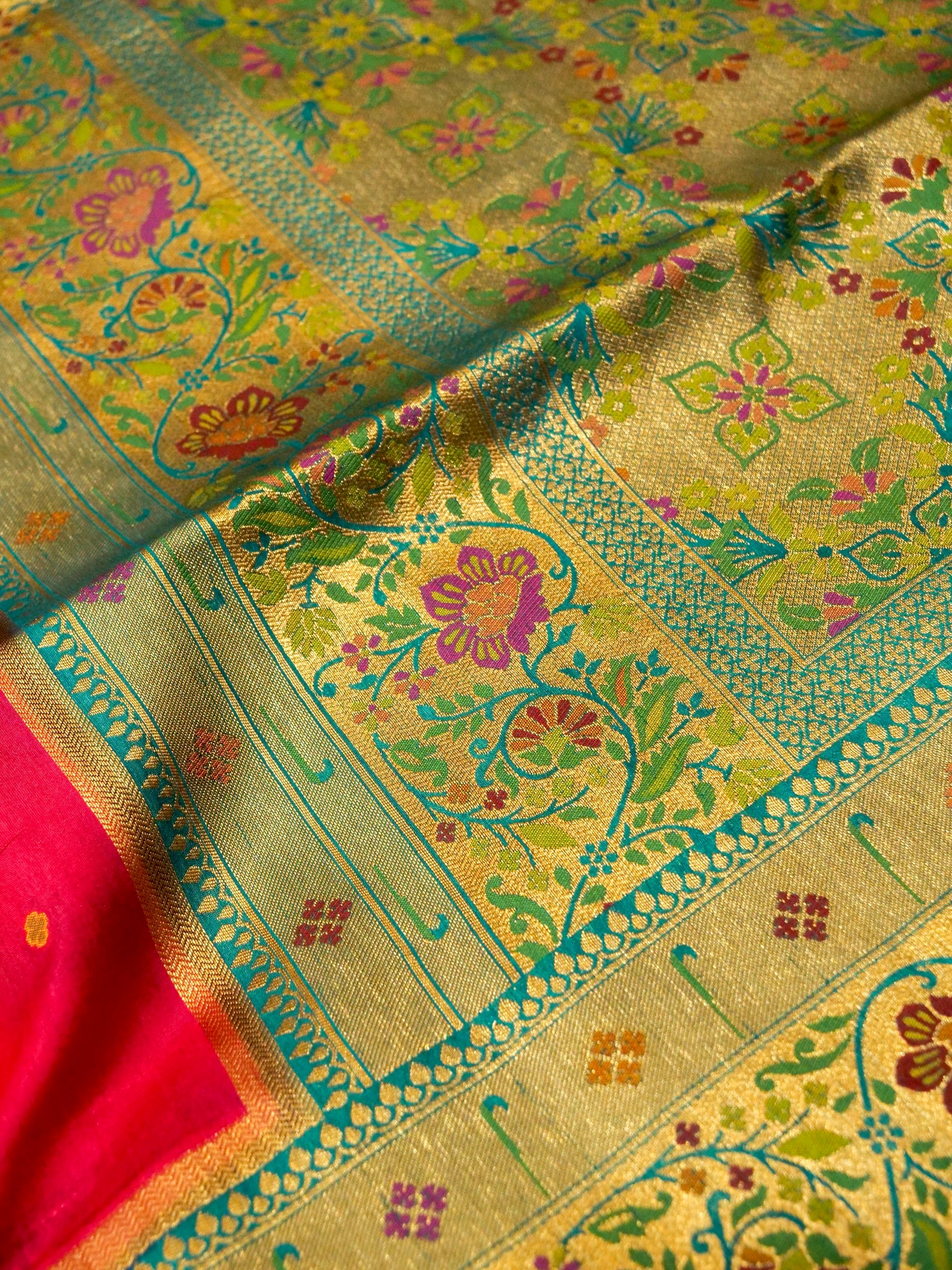 Rani Pink Patola Silk Saree with Contrast Teal Floral Zari Border