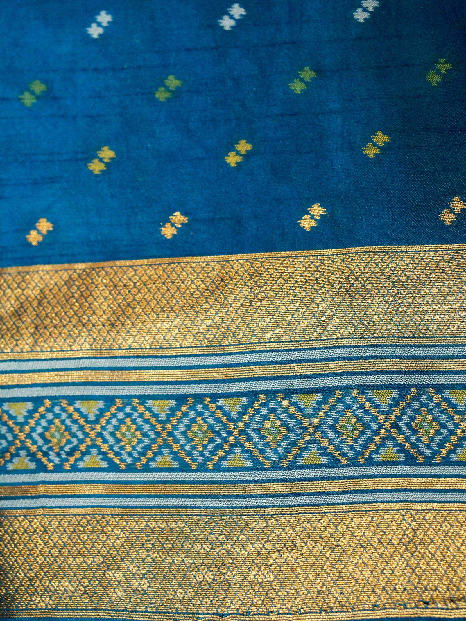Soft Ivory Patola Silk Saree with Peacock Blue Border