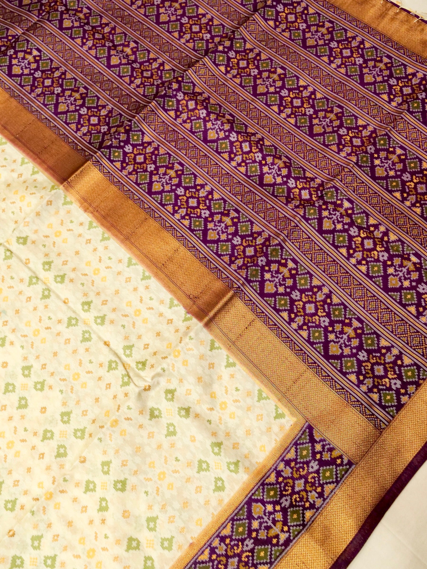 Soft Ivory Patola Silk Saree with Royal Purple Border