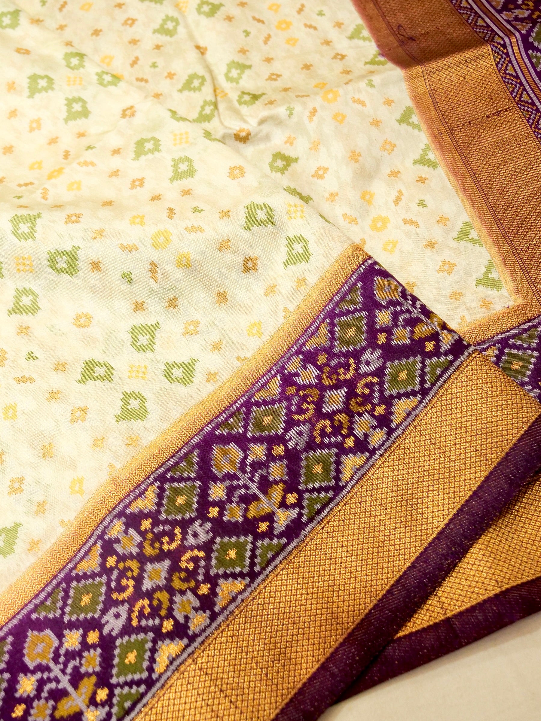 Soft Ivory Patola Silk Saree with Royal Purple Border
