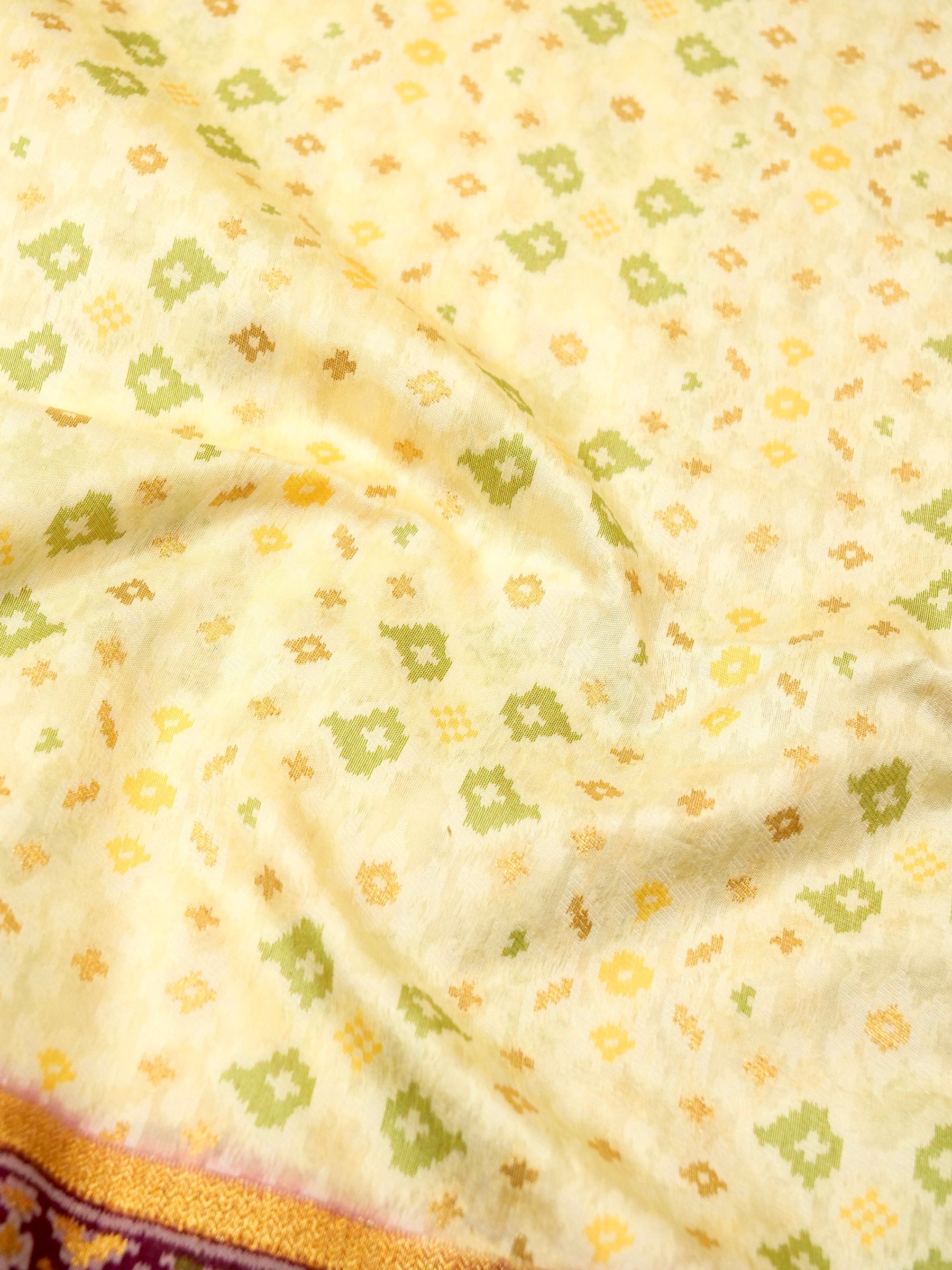 Soft Ivory Patola Silk Saree with Regal Plum Border