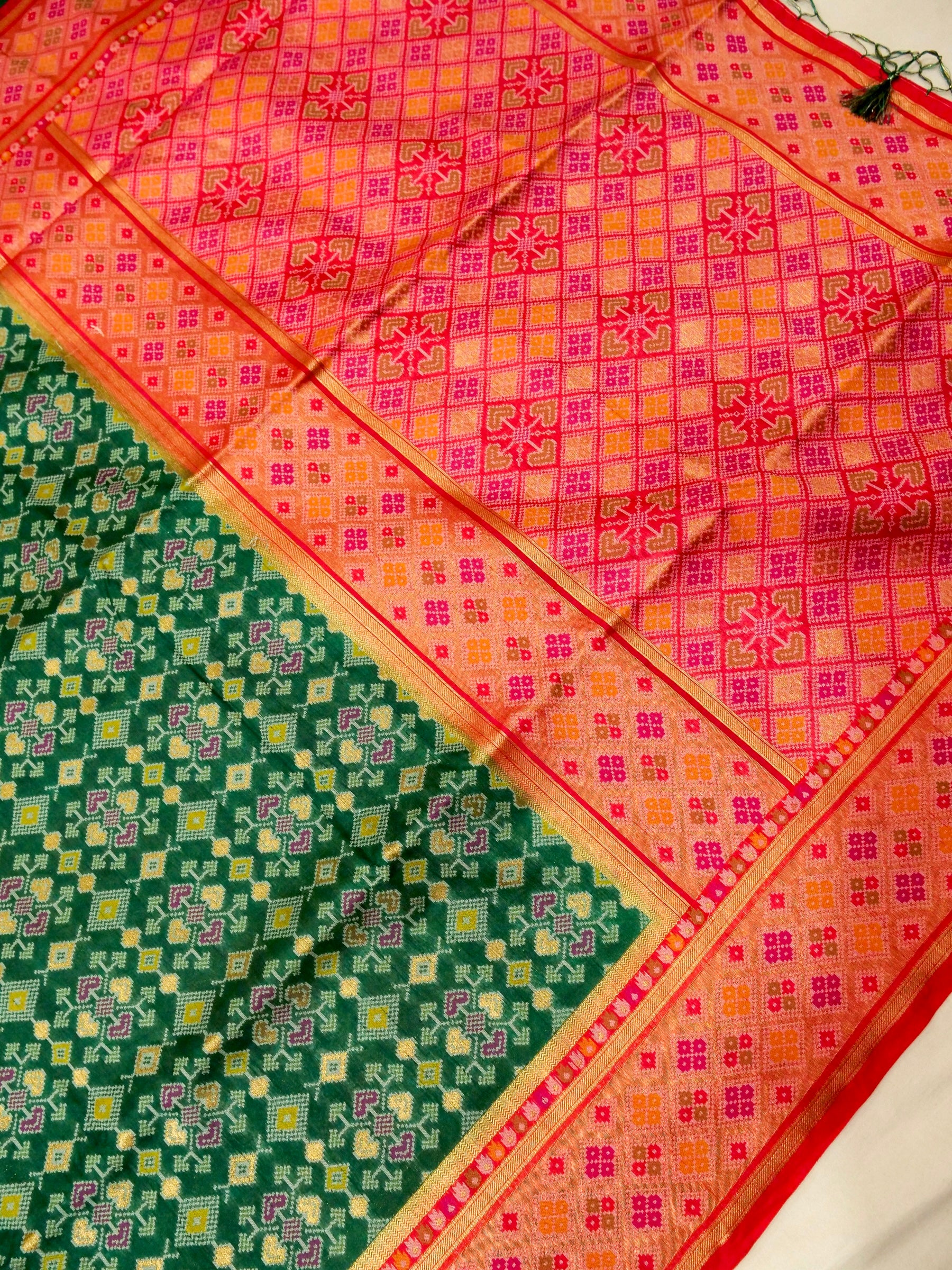 Emerald Green Patola Silk Saree with Contrast Peach Pink Border