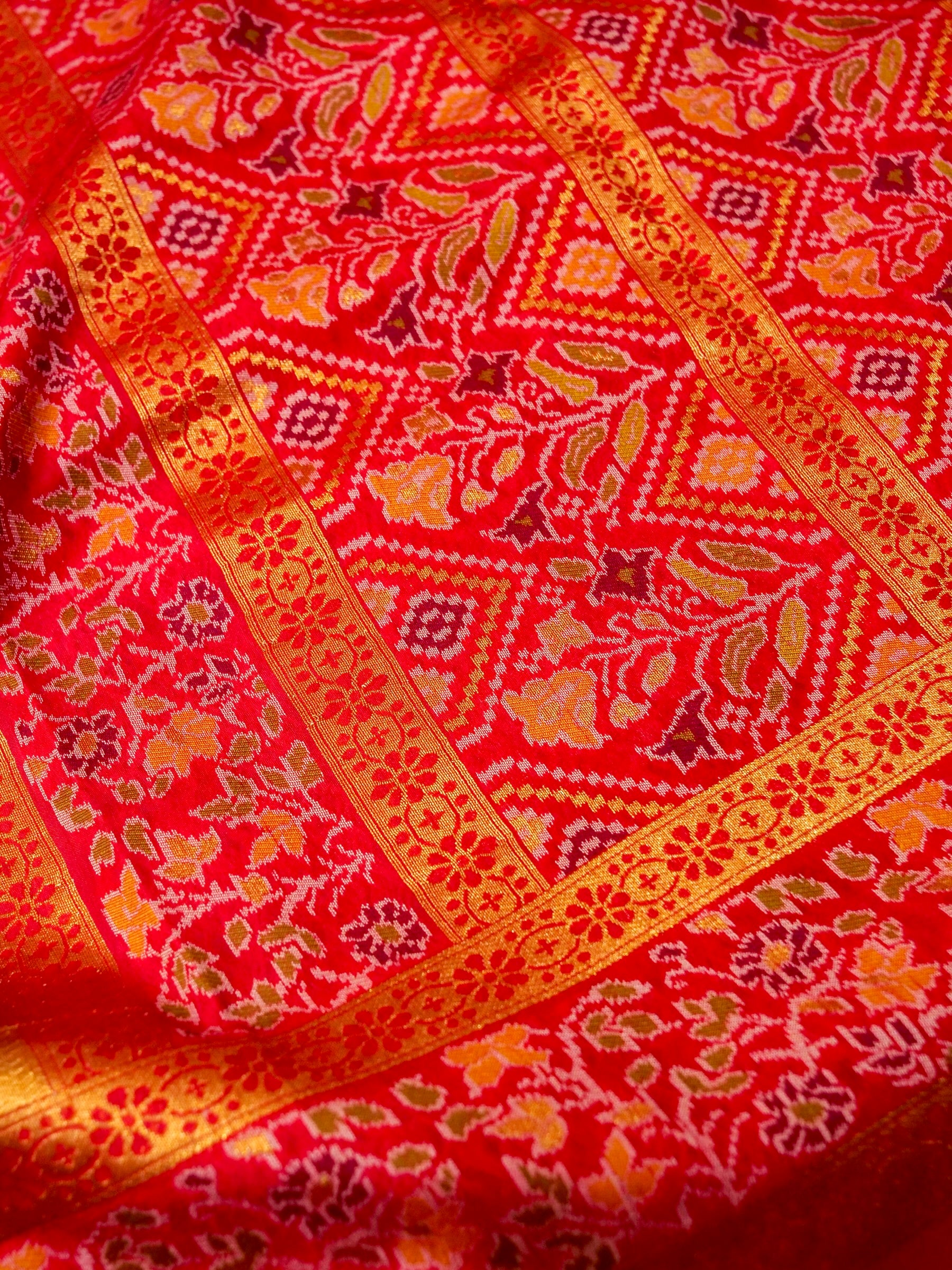 Sea Green Patola Silk Saree with Contrast Rani Pink Floral Zari Border