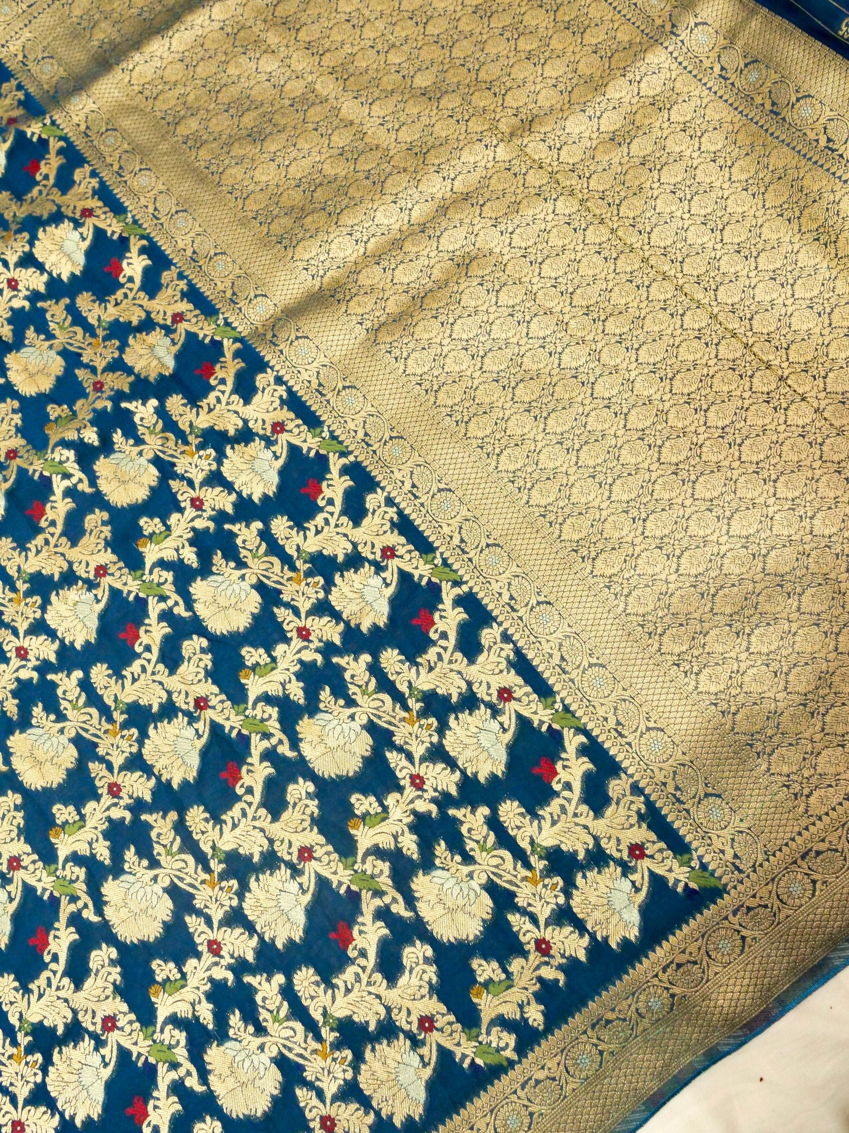 Peacock Blue Crepe Georgette Silk Saree with Gold Border