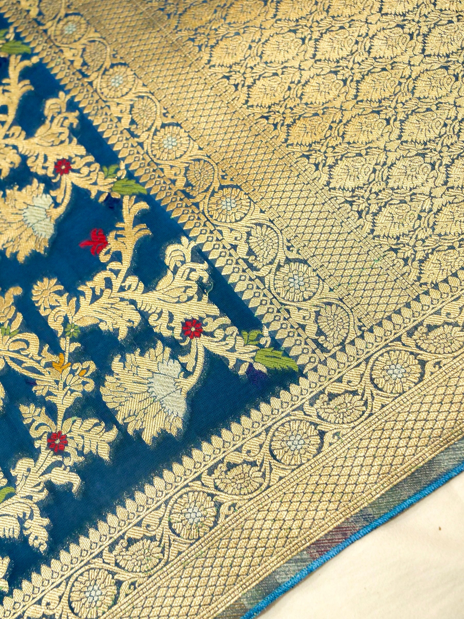 Peacock Blue Crepe Georgette Silk Saree with Gold Border