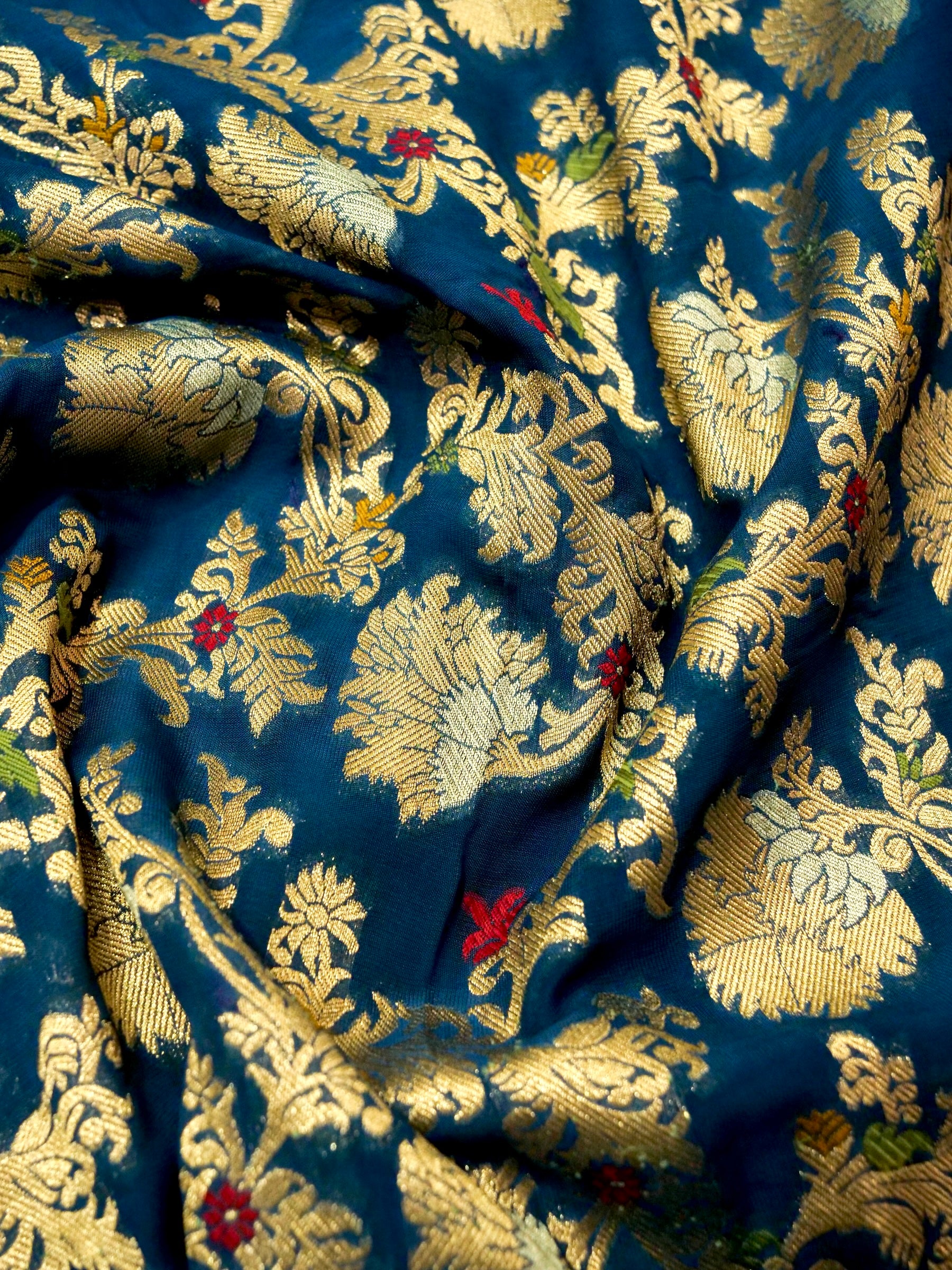 Peacock Blue Crepe Georgette Silk Saree with Gold Border