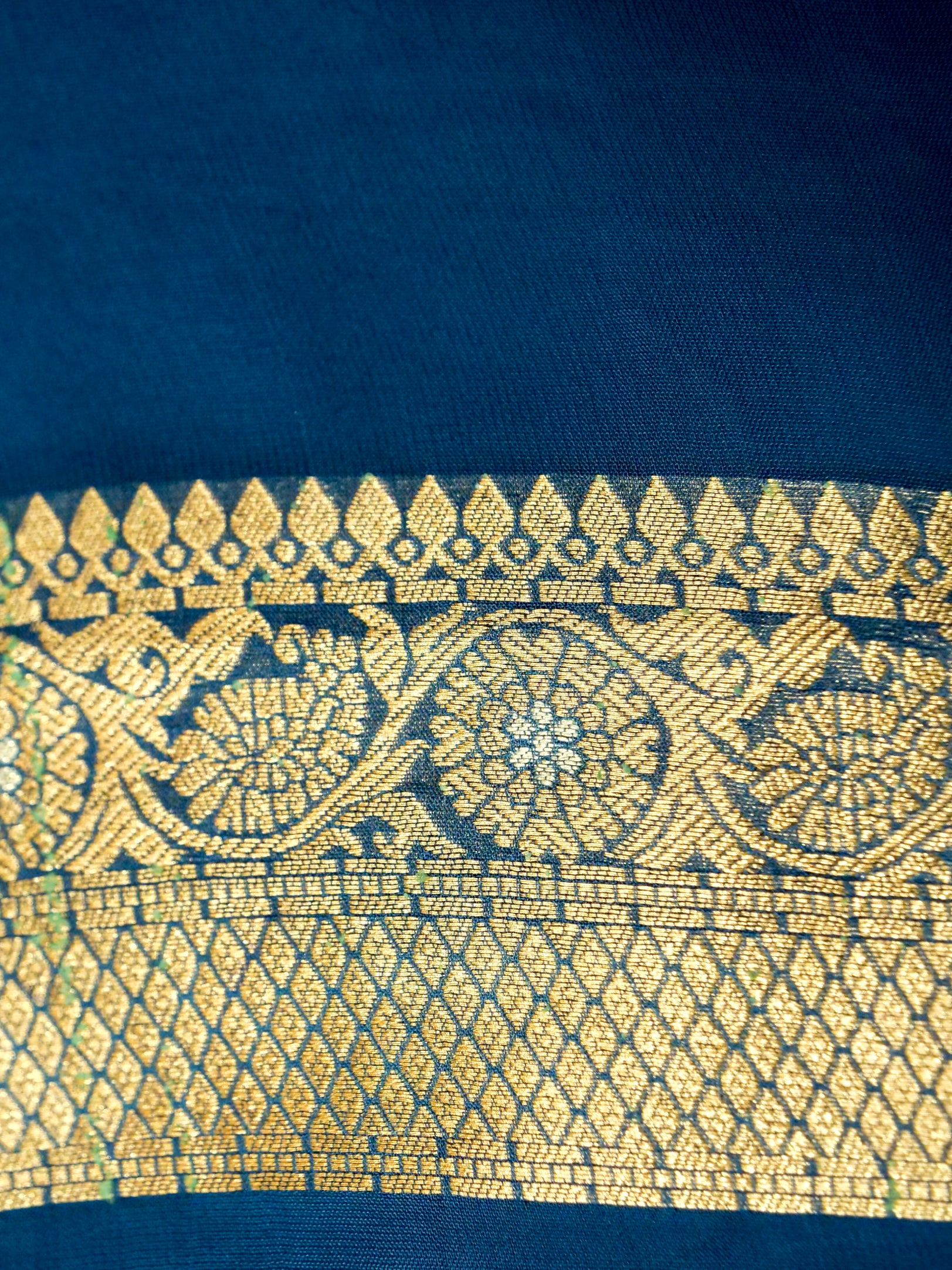 Peacock Blue Crepe Georgette Silk Saree with Gold Border
