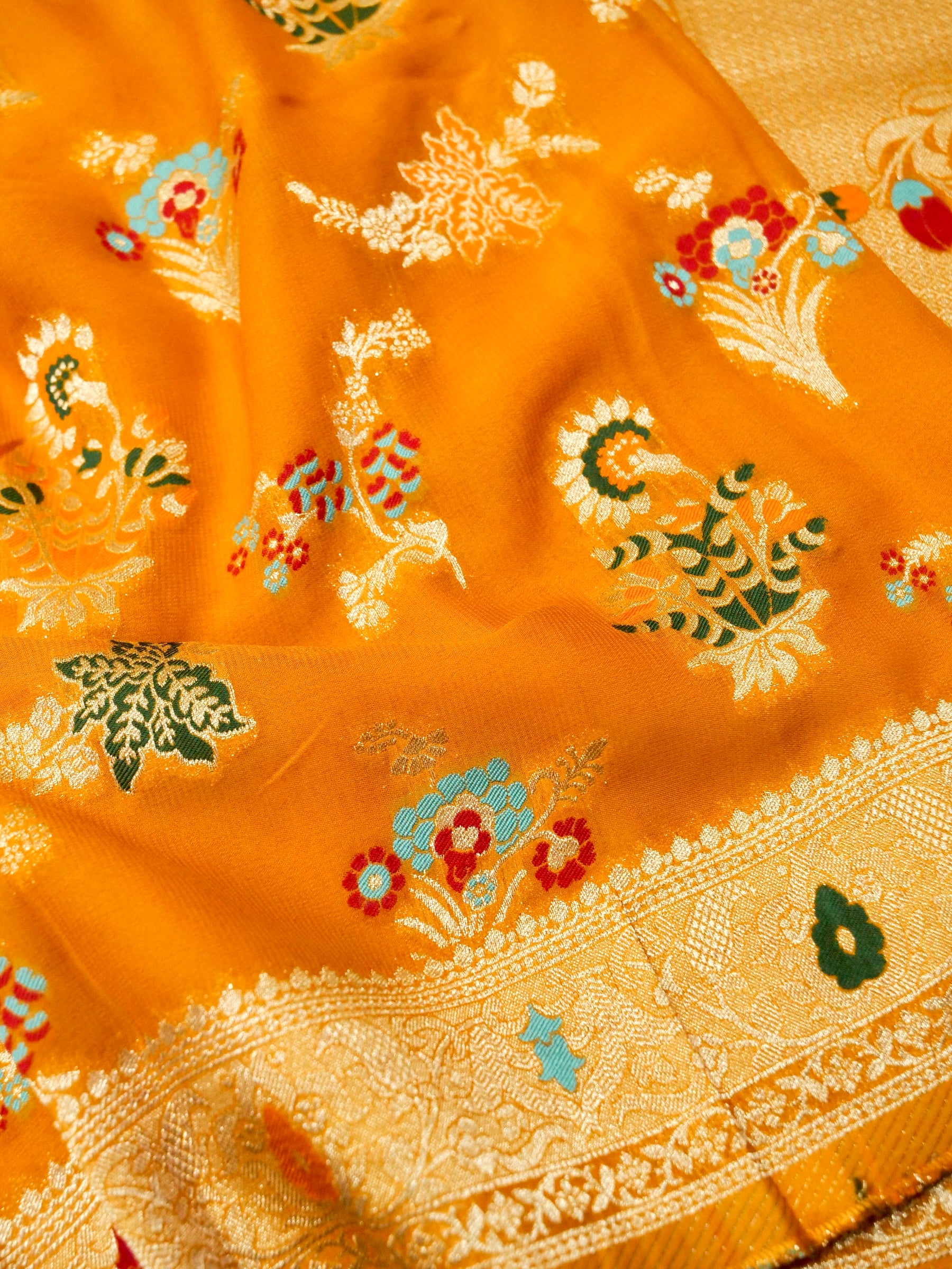 Mustard Orange Crepe Georgette Silk Saree with Champagne Gold Border