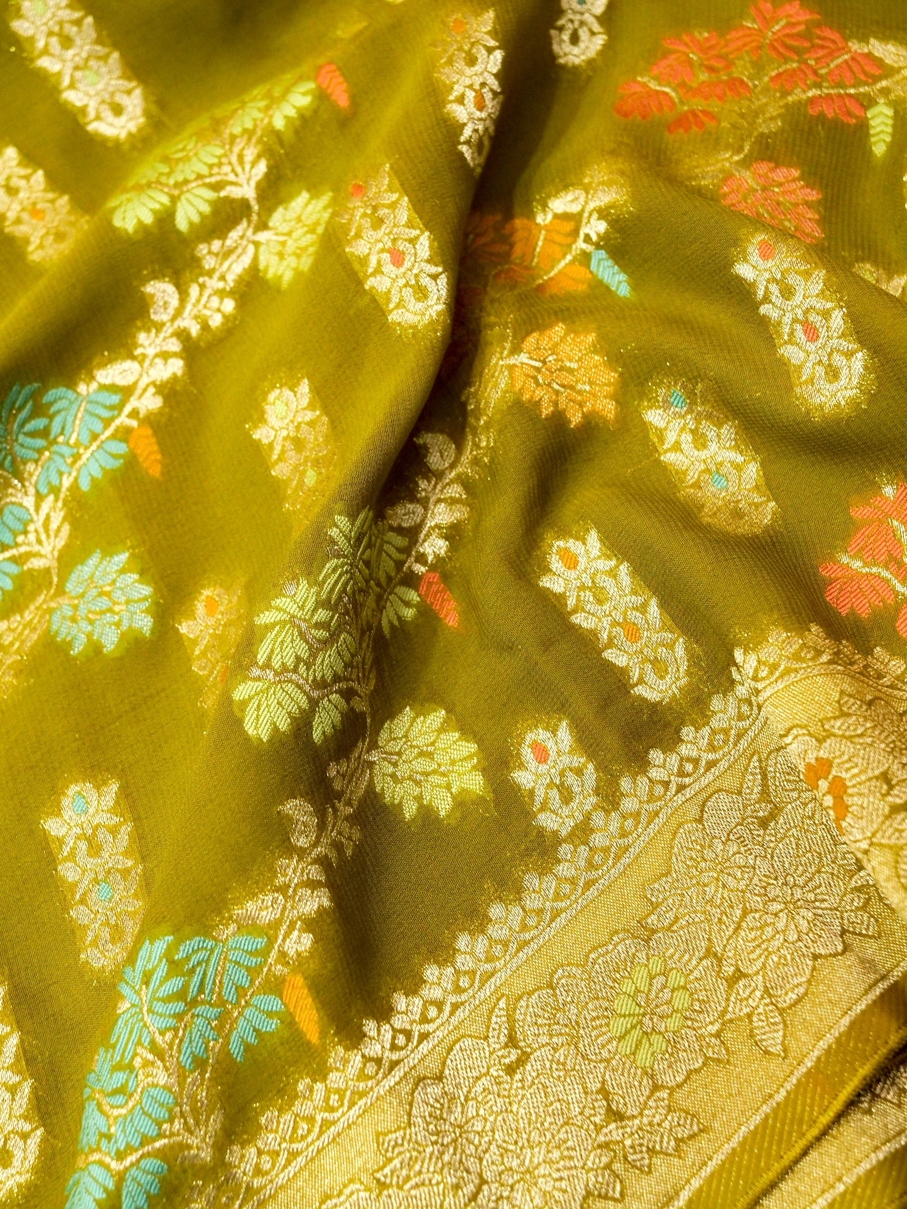 Moss Green Crepe Georgette Silk Saree with Champagne Border