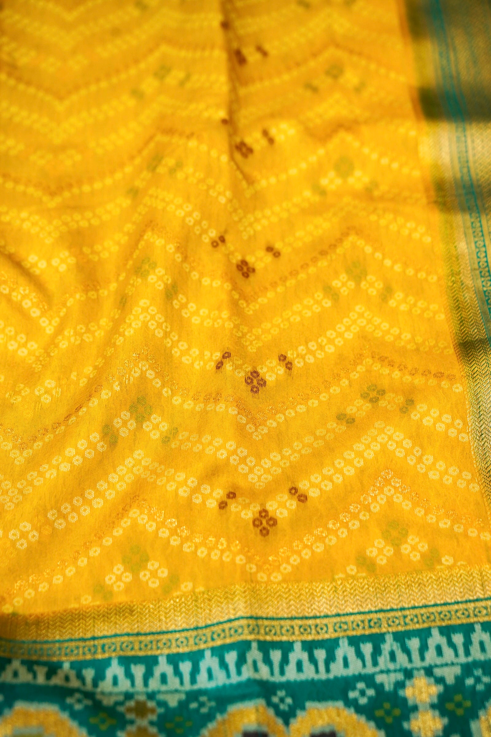 Mustard Yellow Ikkat Patola Silk Saree with Teal Border and Stitched Blouse