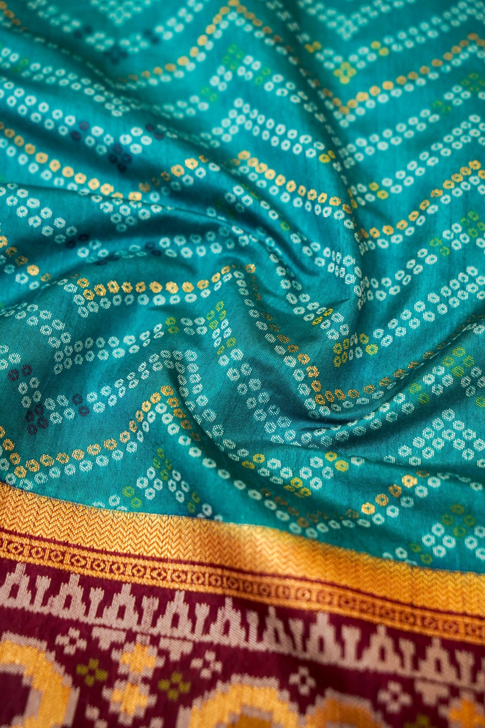 Turquoise Blue Ikkat Patola Silk Saree with Wine Border and Stitched Blouse
