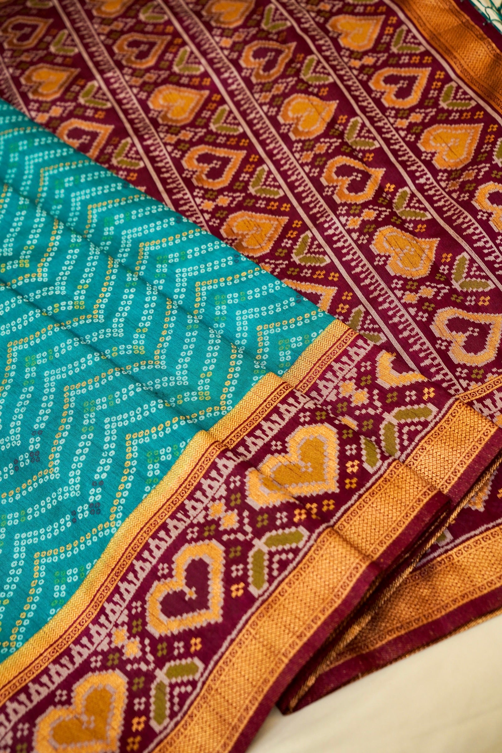 Turquoise Blue Ikkat Patola Silk Saree with Wine Border and Stitched Blouse