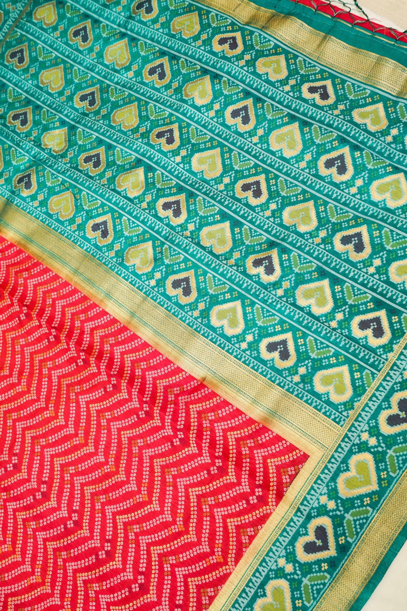 Bright Red Ikkat Patola Silk Saree with Teal Border and Stitched Blouse