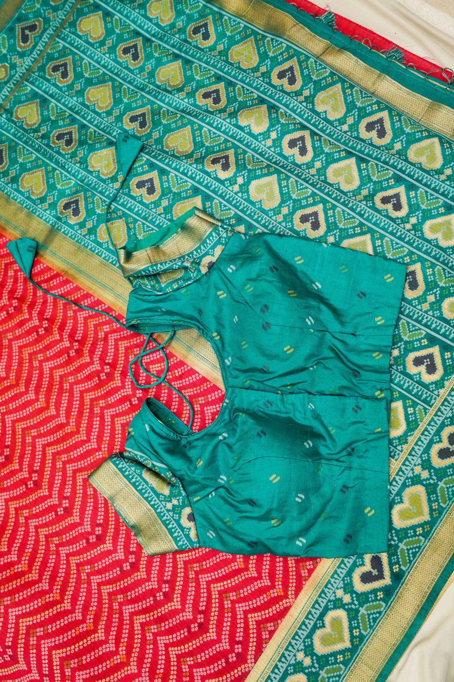 Bright Red Ikkat Patola Silk Saree with Teal Border and Stitched Blouse