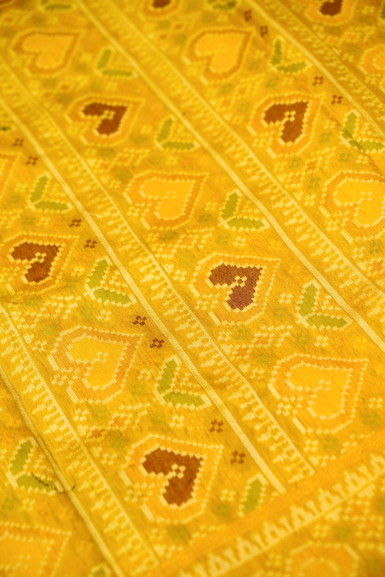 Deep Plum Ikkat Patola Silk Saree with Mustard Border and Stitched Blouse