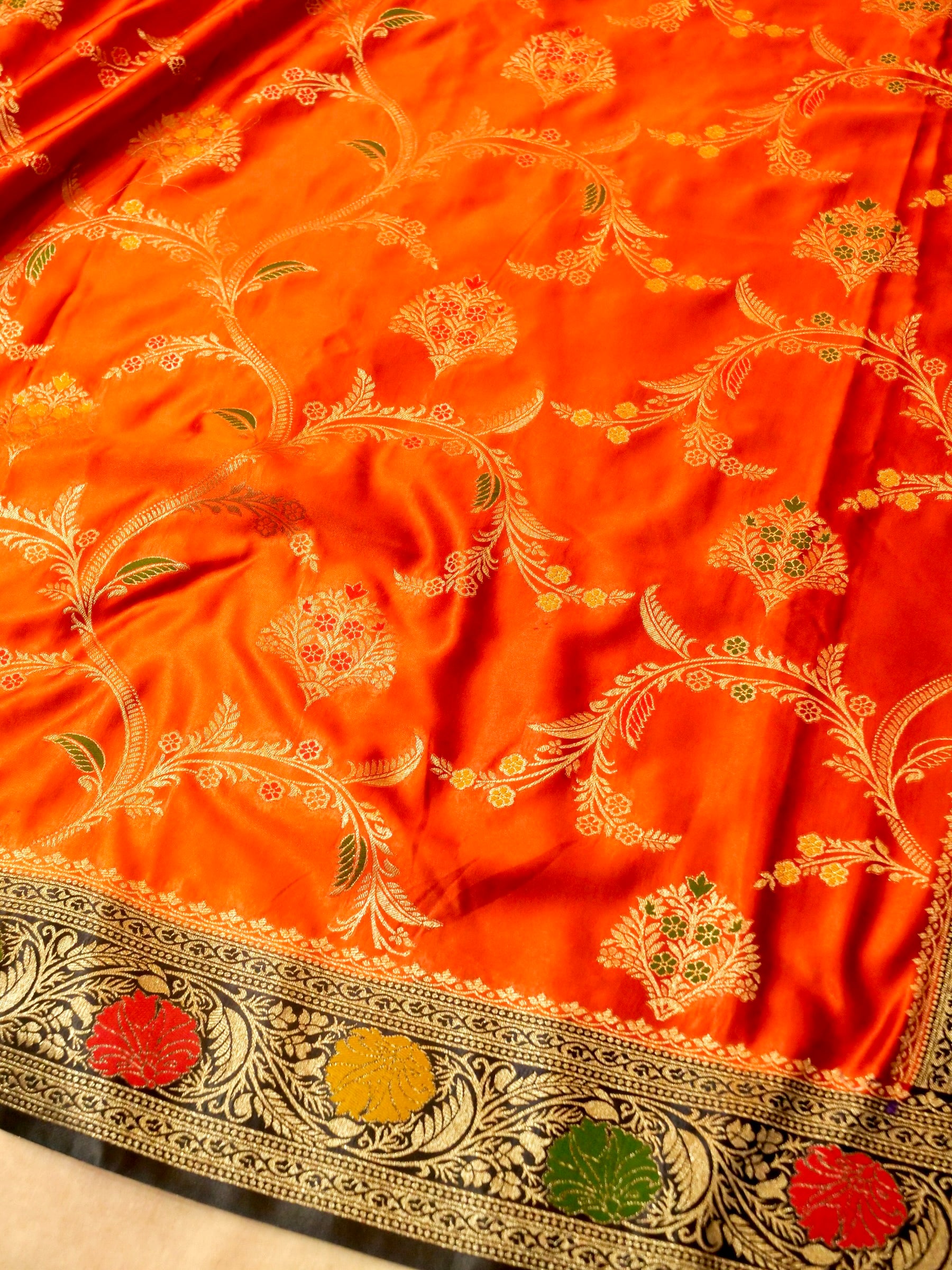 Vibrant Orange Satin Mashru Silk Saree with Black & Gold Zari Border