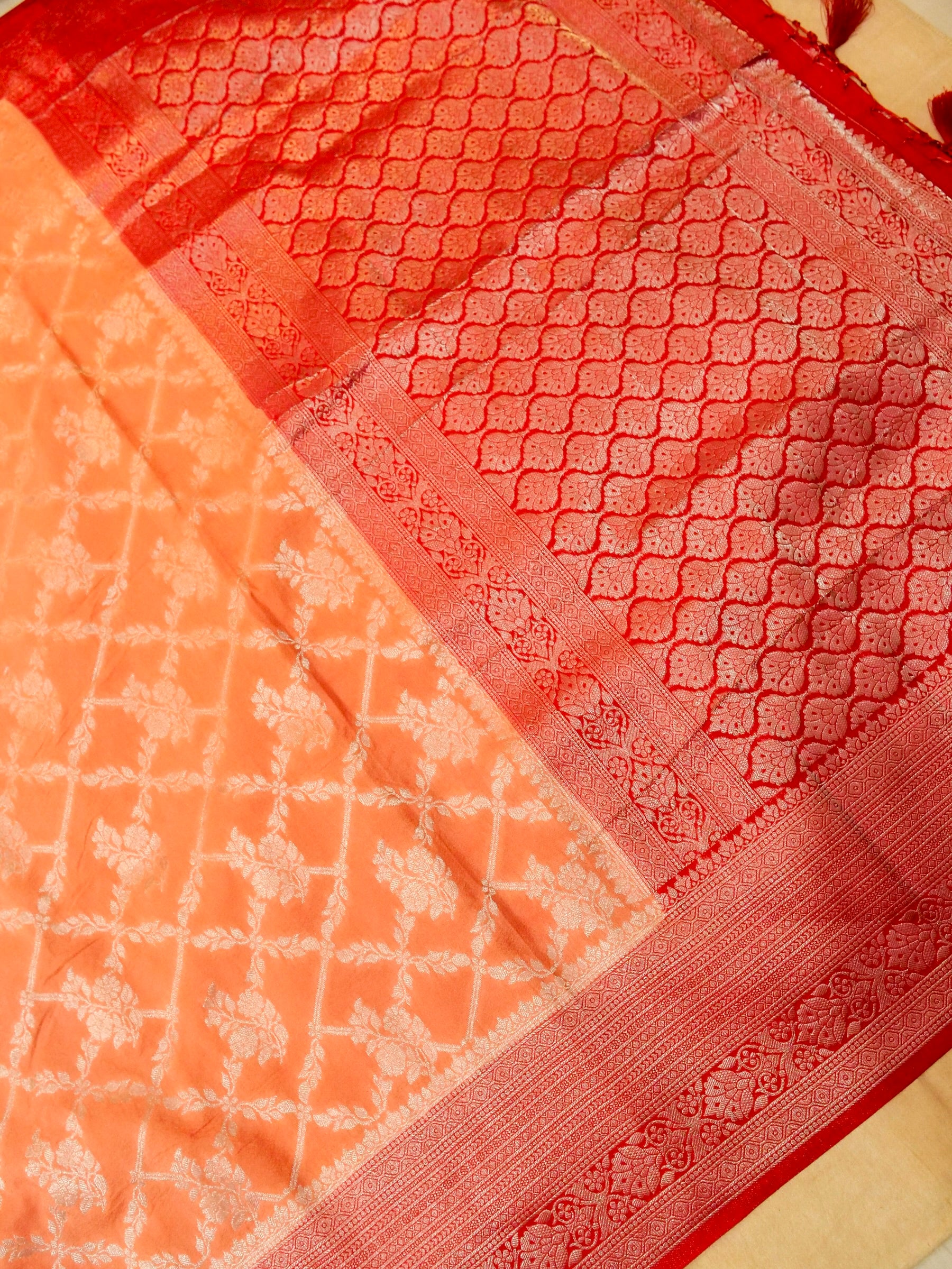 Pastel Orange Crepe Georgette Silk Saree with Red Border