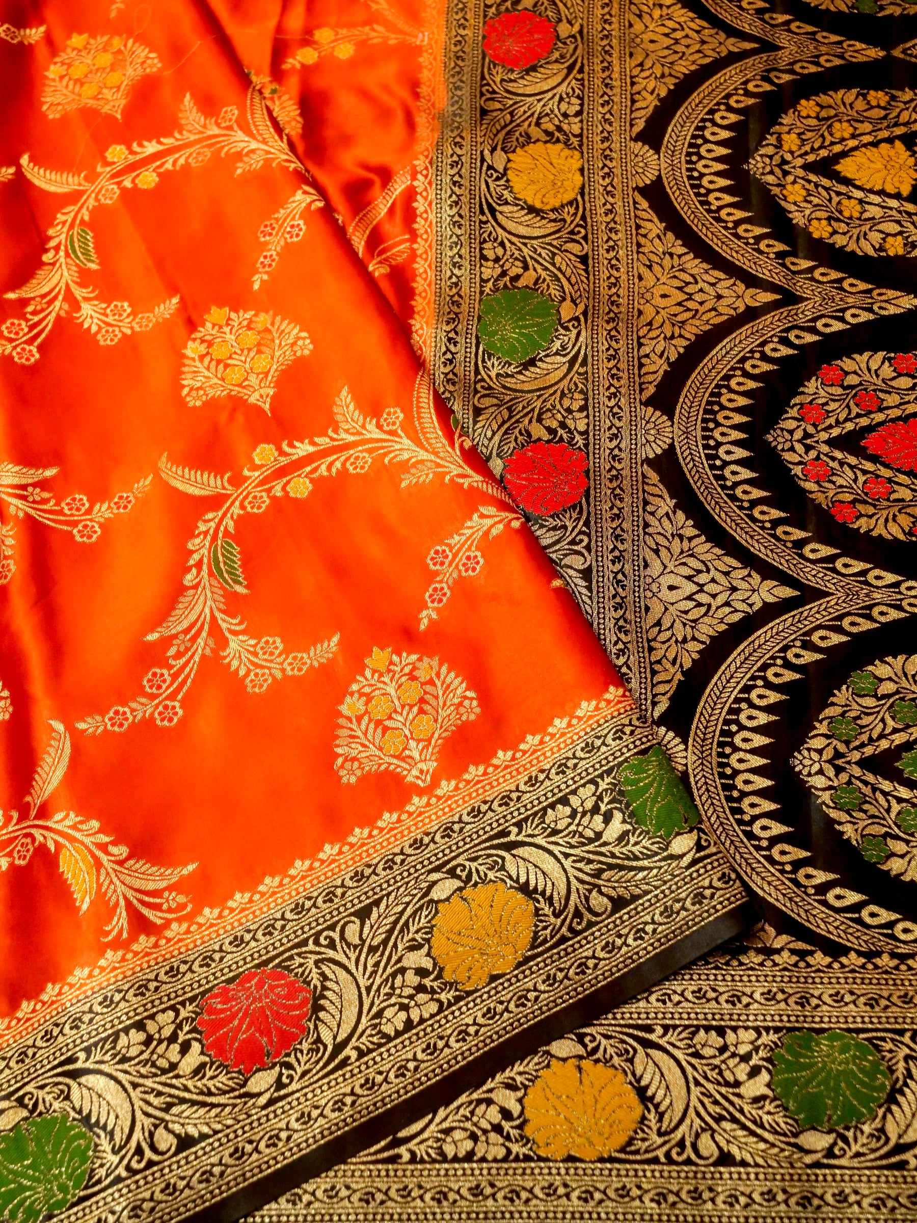 Vibrant Orange Satin Mashru Silk Saree with Black & Gold Zari Border