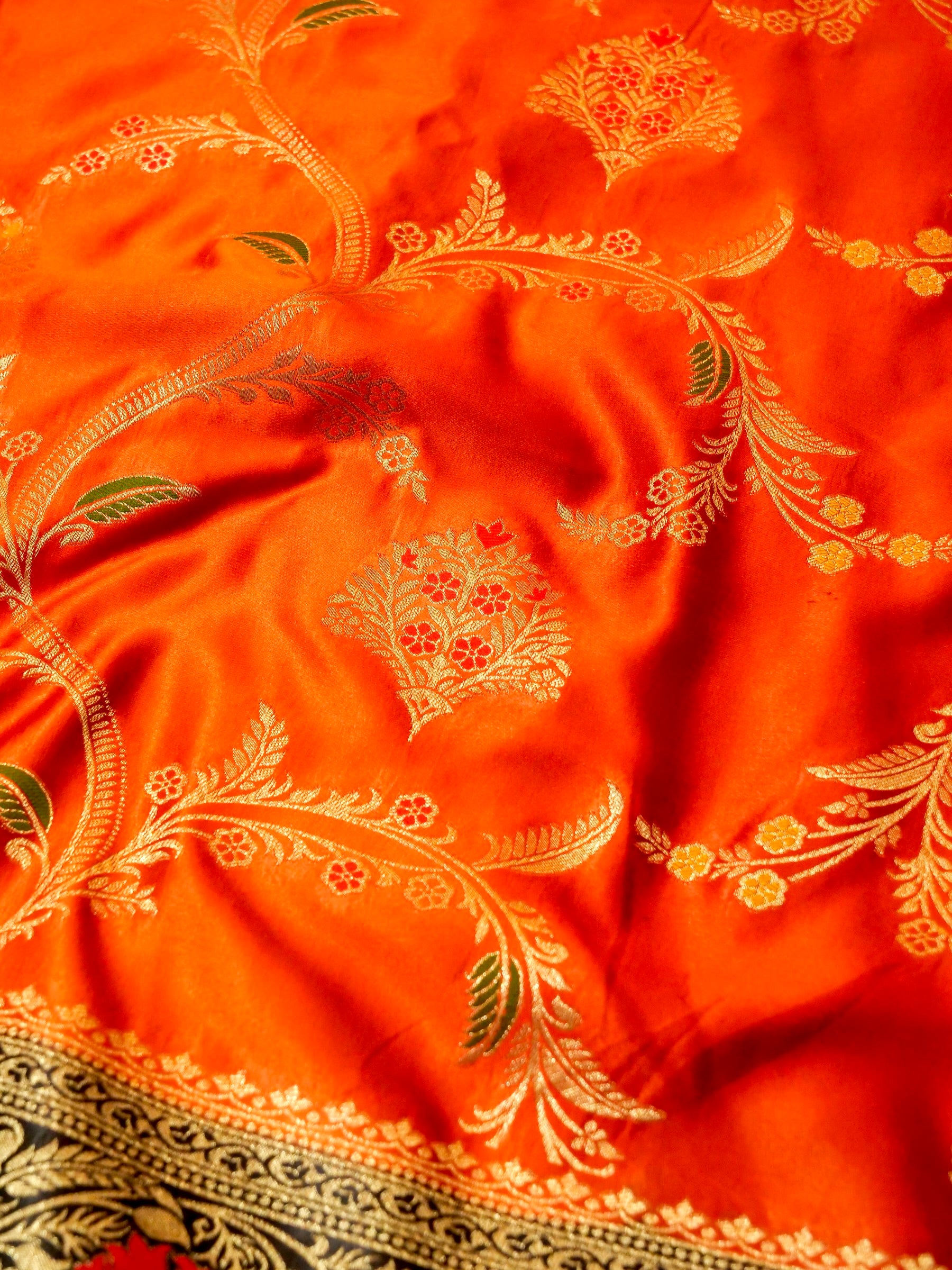 Vibrant Orange Satin Mashru Silk Saree with Black & Gold Zari Border