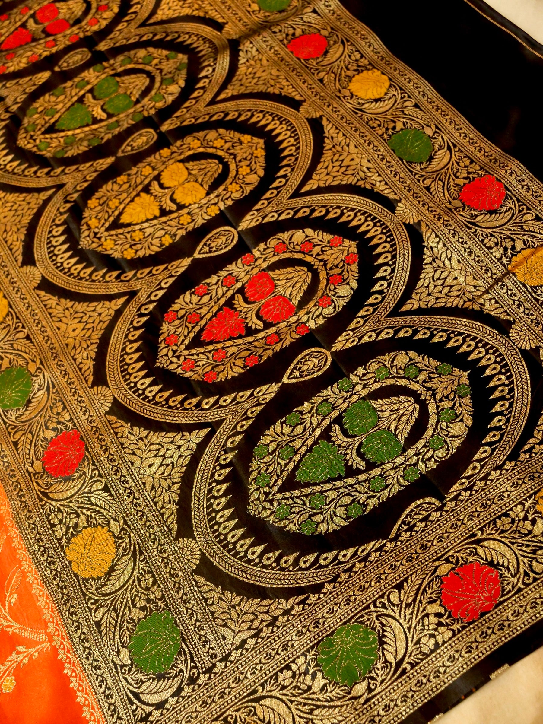 Vibrant Orange Satin Mashru Silk Saree with Black & Gold Zari Border