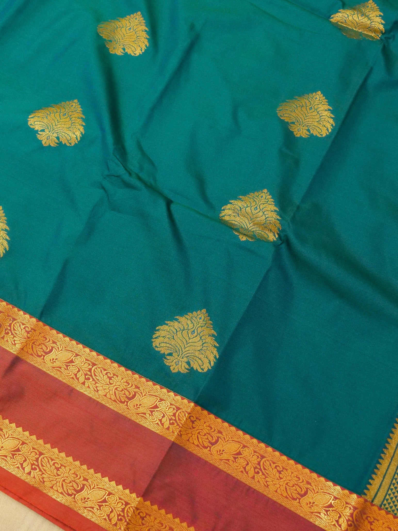 Devi - Peacock Teal Blue Kanjivaram Silk Saree with Korvai Border